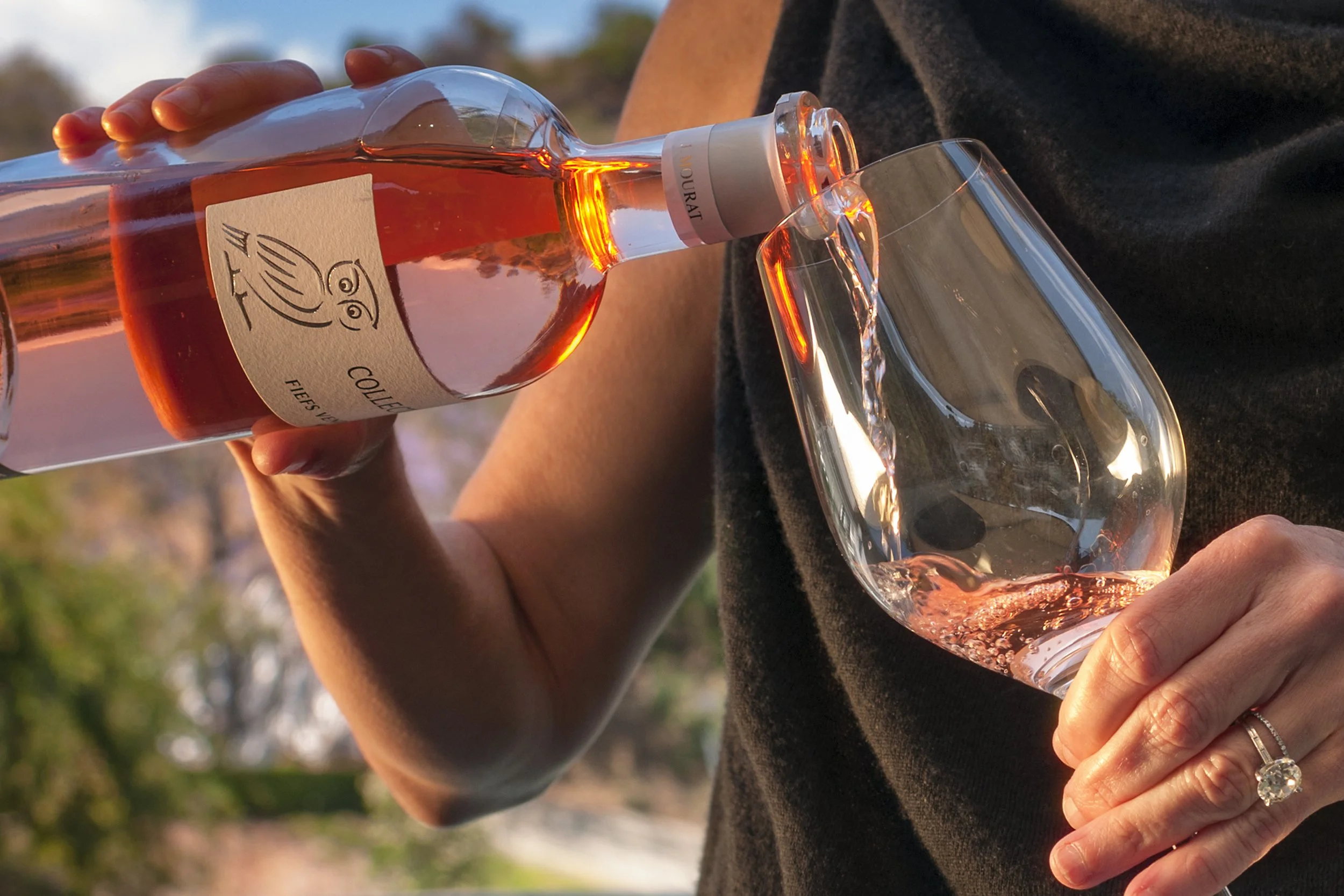 _DSC7308 Caroline Pours Wine 3 Cropped Tigher.jpg