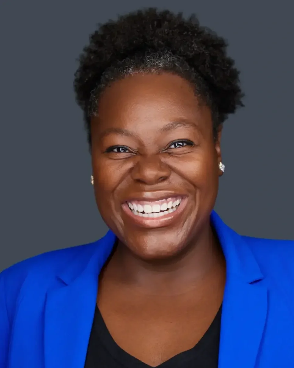 A genuine large smile being portrayed by female actress