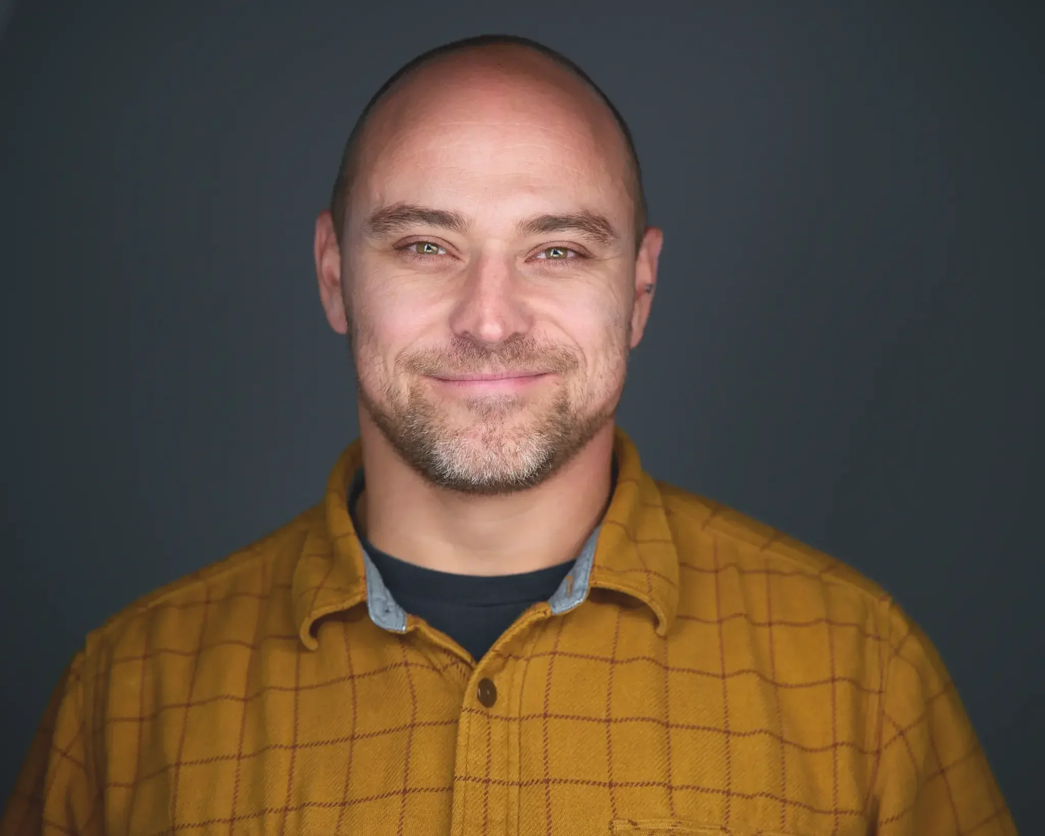 headshot of a guy at a conference, captured on site