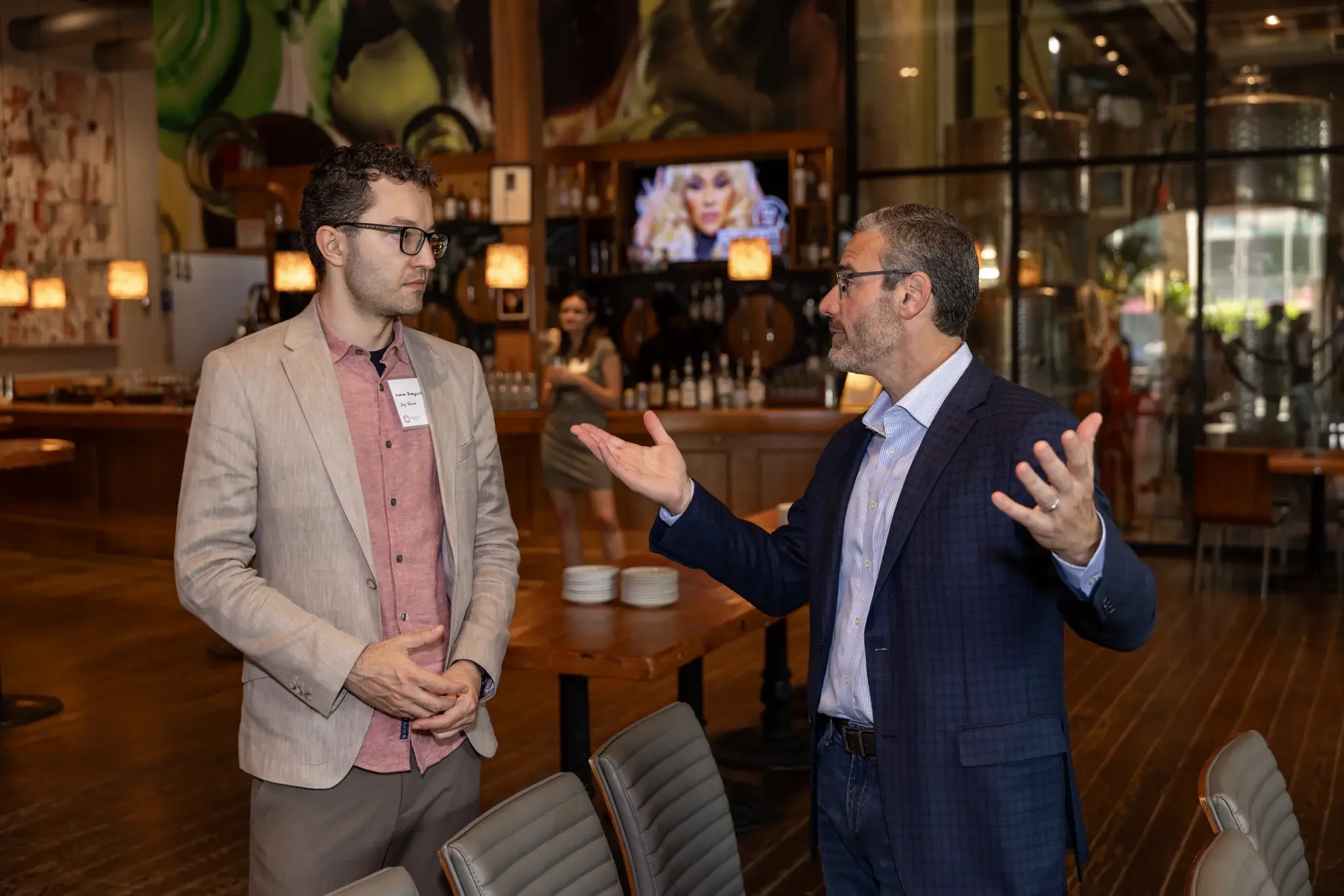 two company event attendees chatting