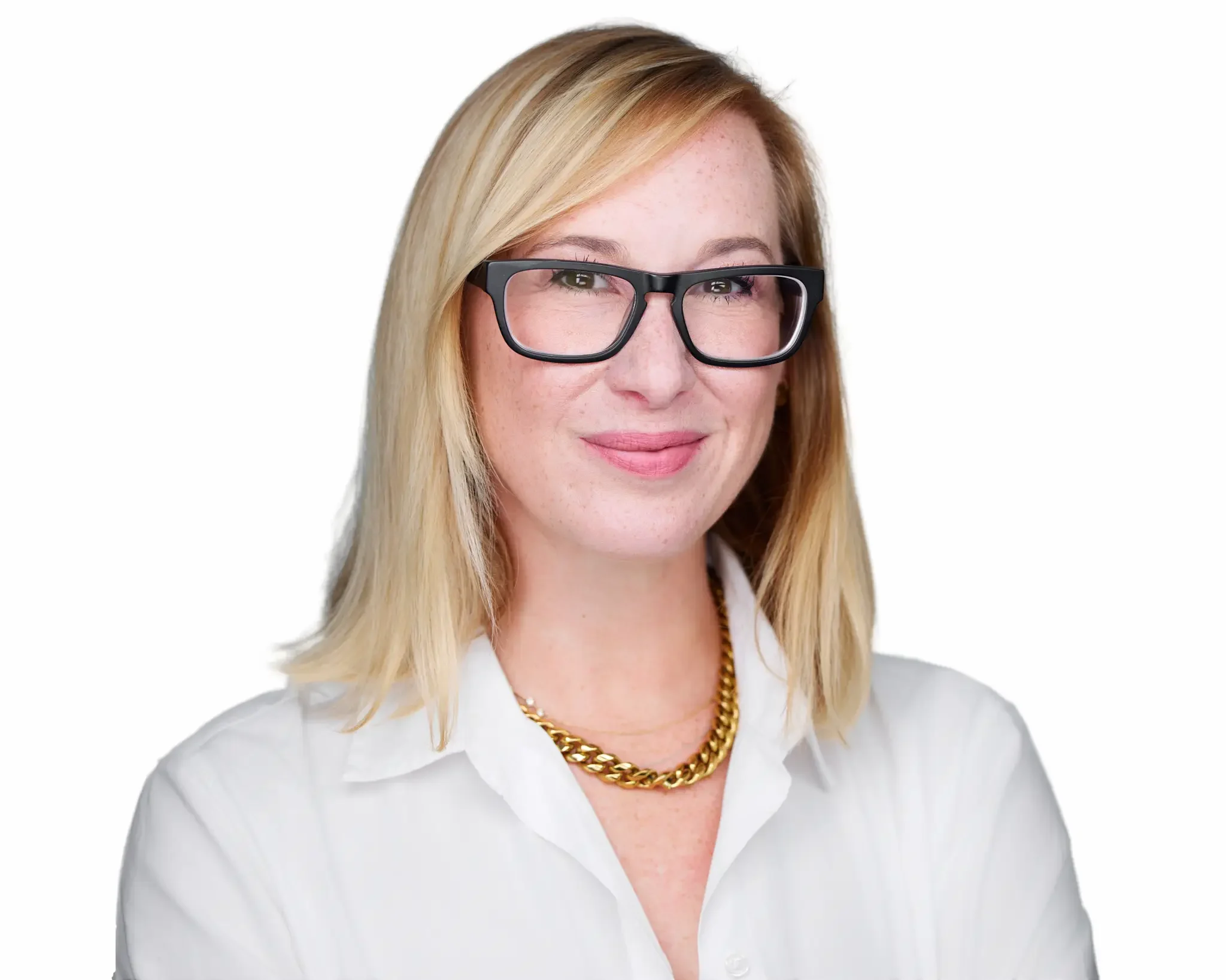 A woman with blonde hair, wearing glasses, a white shirt, a gold chain necklace, and smiling at the camera.