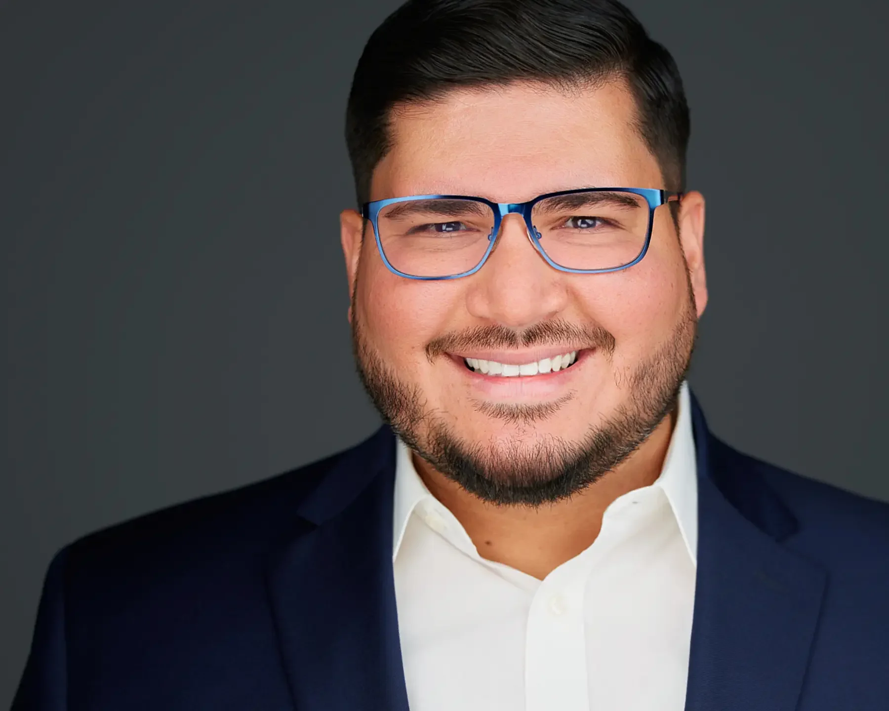 chicago exec with glasses smiling for a business portrait