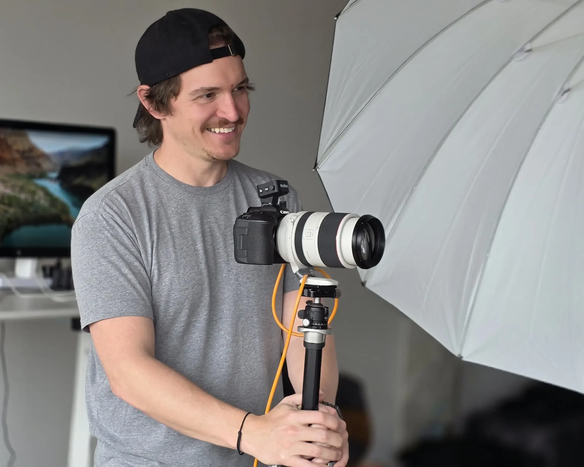 Cameron, Chicago headshot photographer, behind the camera during a studio session