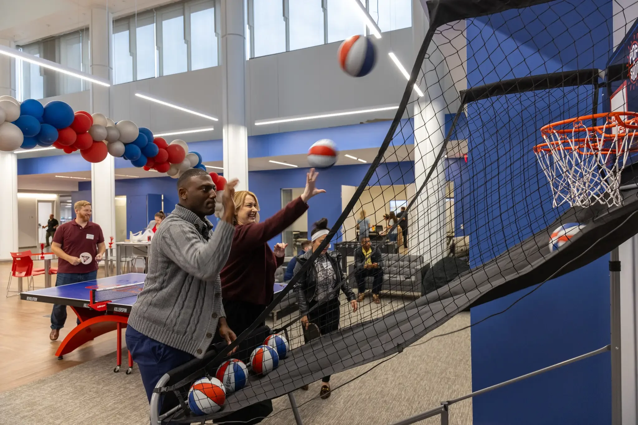 employees playing basketball game during a company party