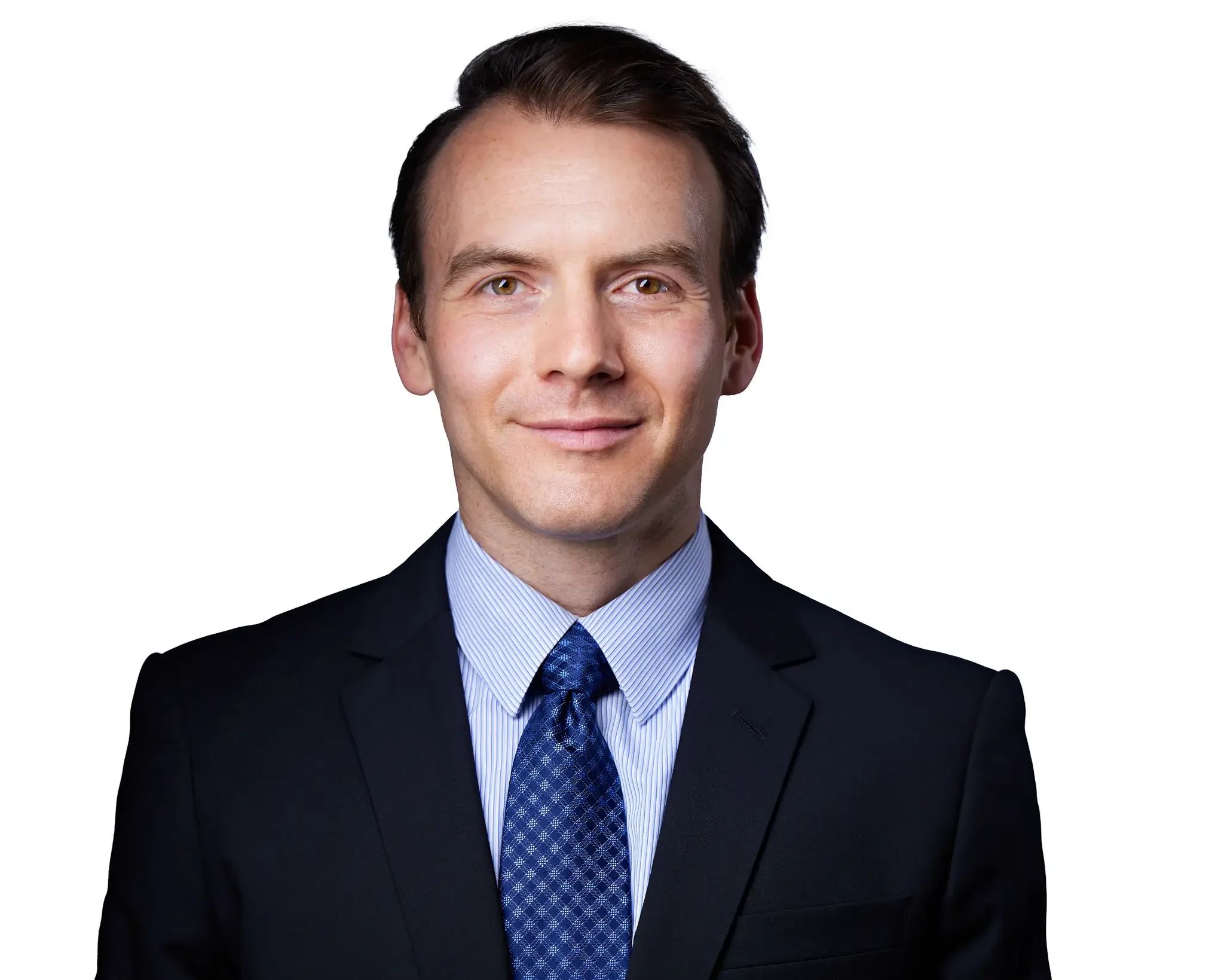 Professional headshot of a smiling man in a dark suit, light blue dress shirt, and patterned blue tie, against a white background.
