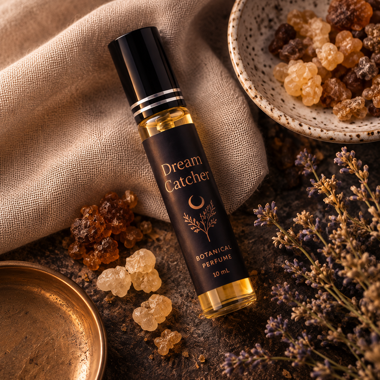 Dream Catcher Botanical Perfume Spray arranged with aromatic resins, dried botanicals, and natural linen