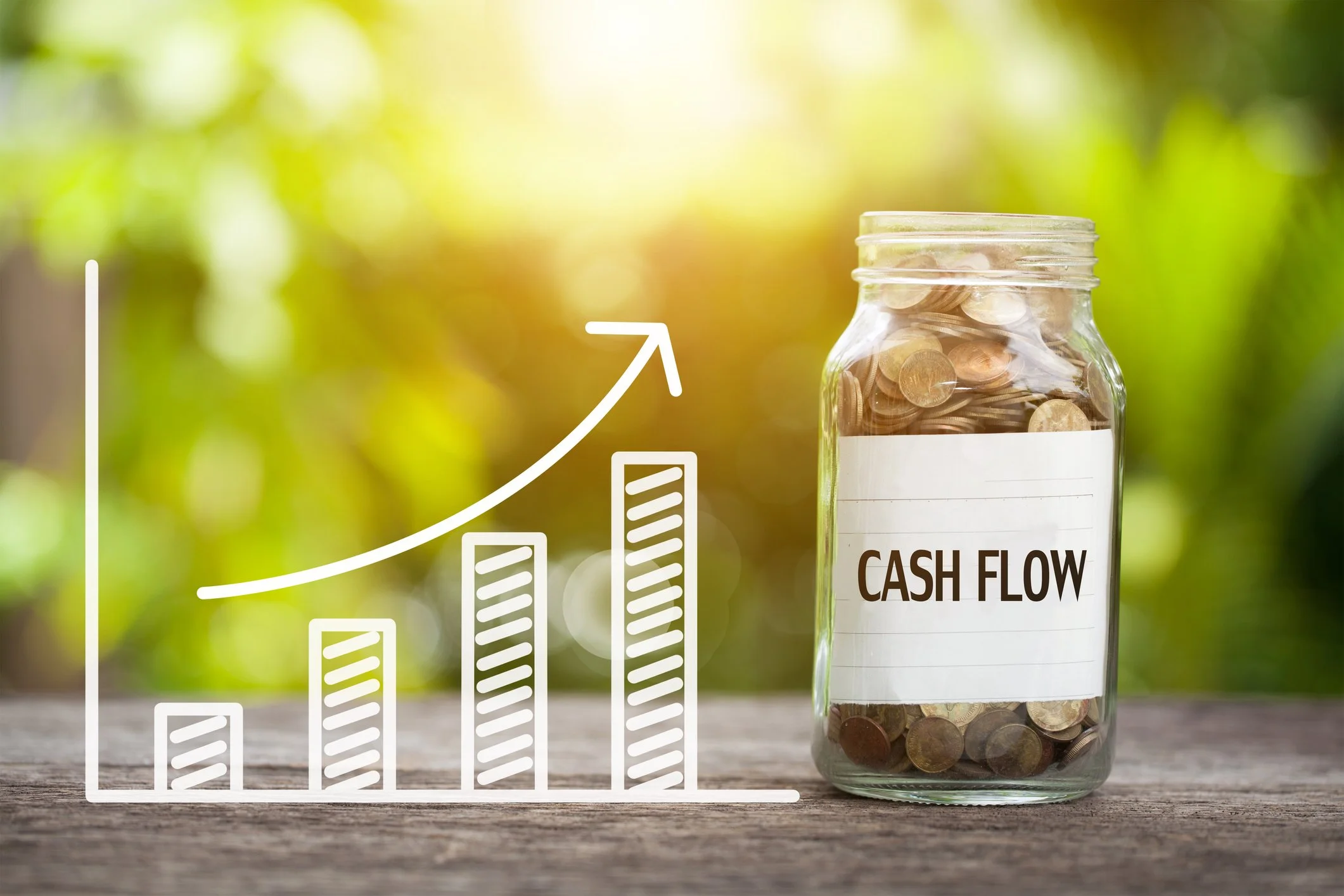 A jar labeled 'Cash Flow' filled with coins, signifying how invoice finance can grow your cash reserves