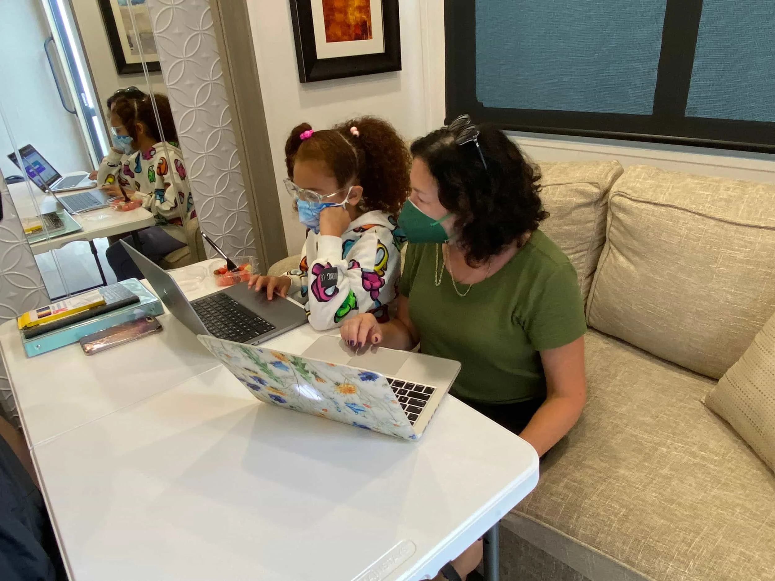 studio teacher tutoring child actor between scenes