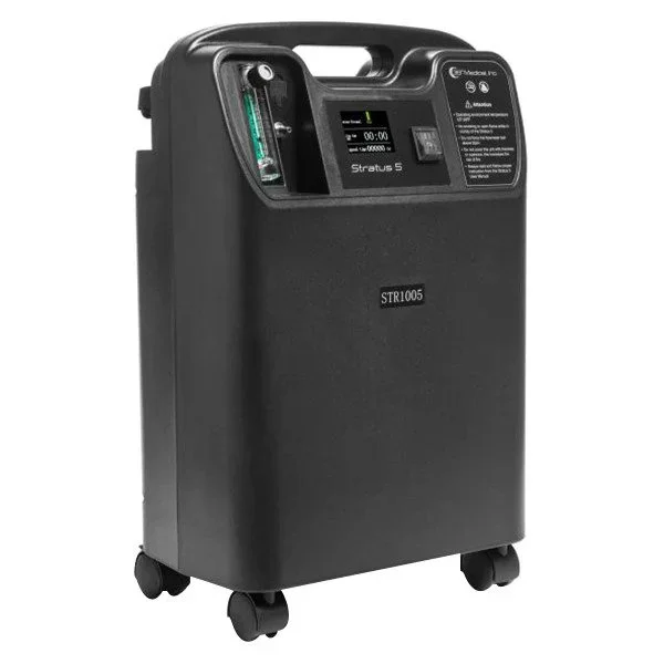 A portable medical oxygen concentrator with a digital display, control buttons, and air filters, mounted on wheels for mobility.