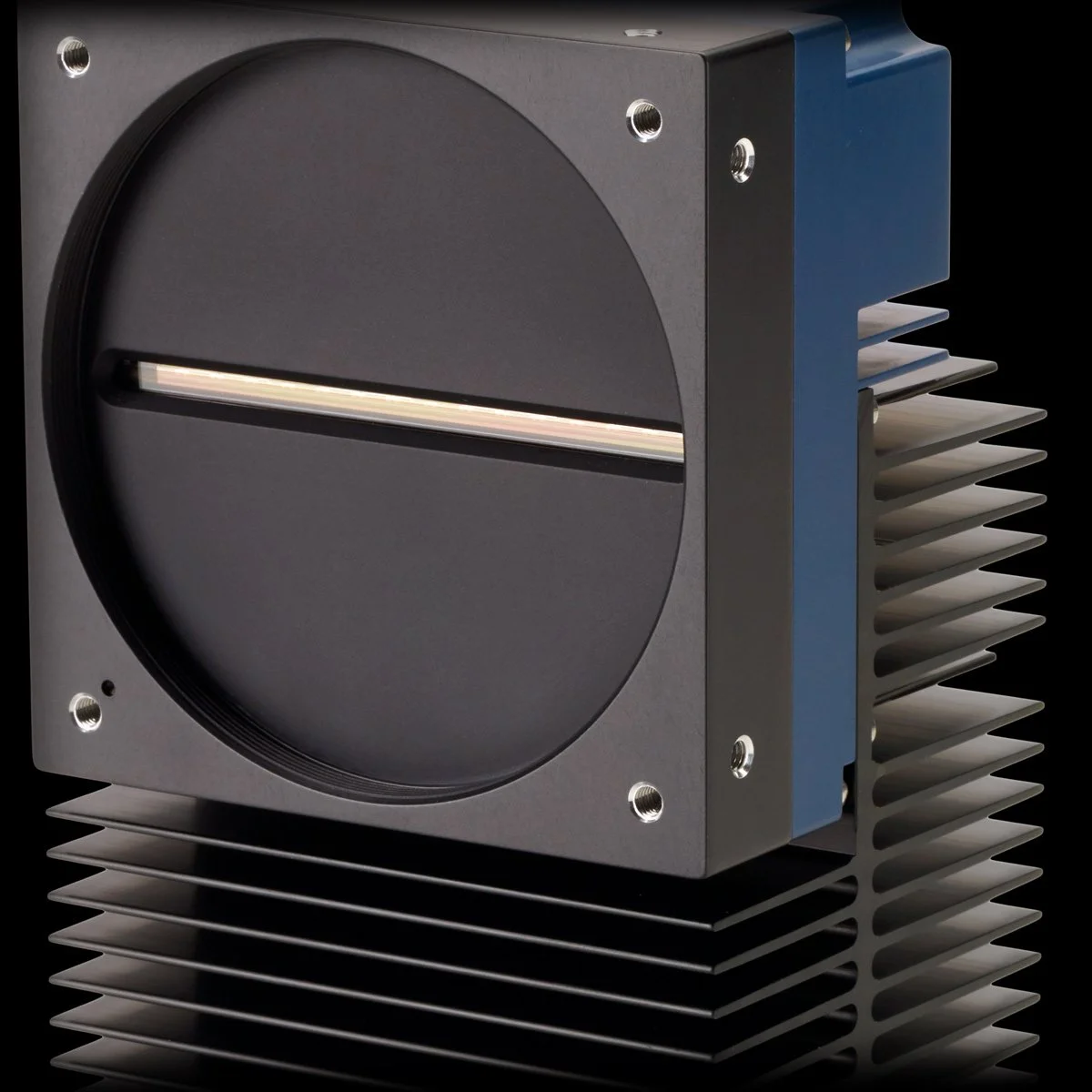 An industrial line scan sensor device with a large black circular lens mount and a finned heatsink for cooling, set against a black background.