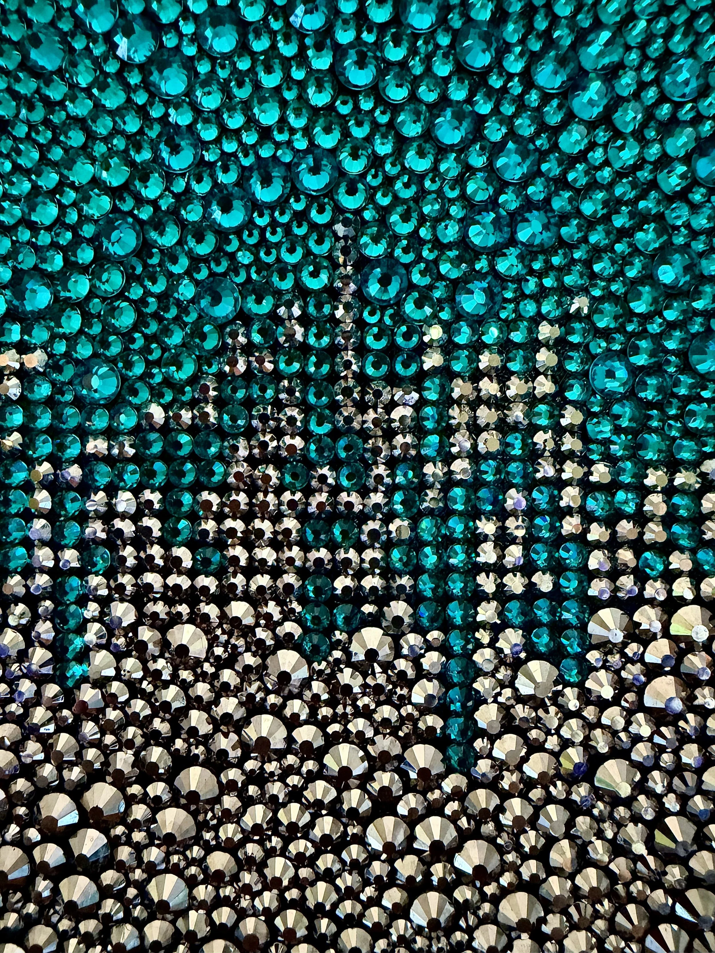 A 6x6-inch sculptural artwork titled "Bitter" featuring a high-relief, textured gradient of teal and brilliant hematite rhinestones.