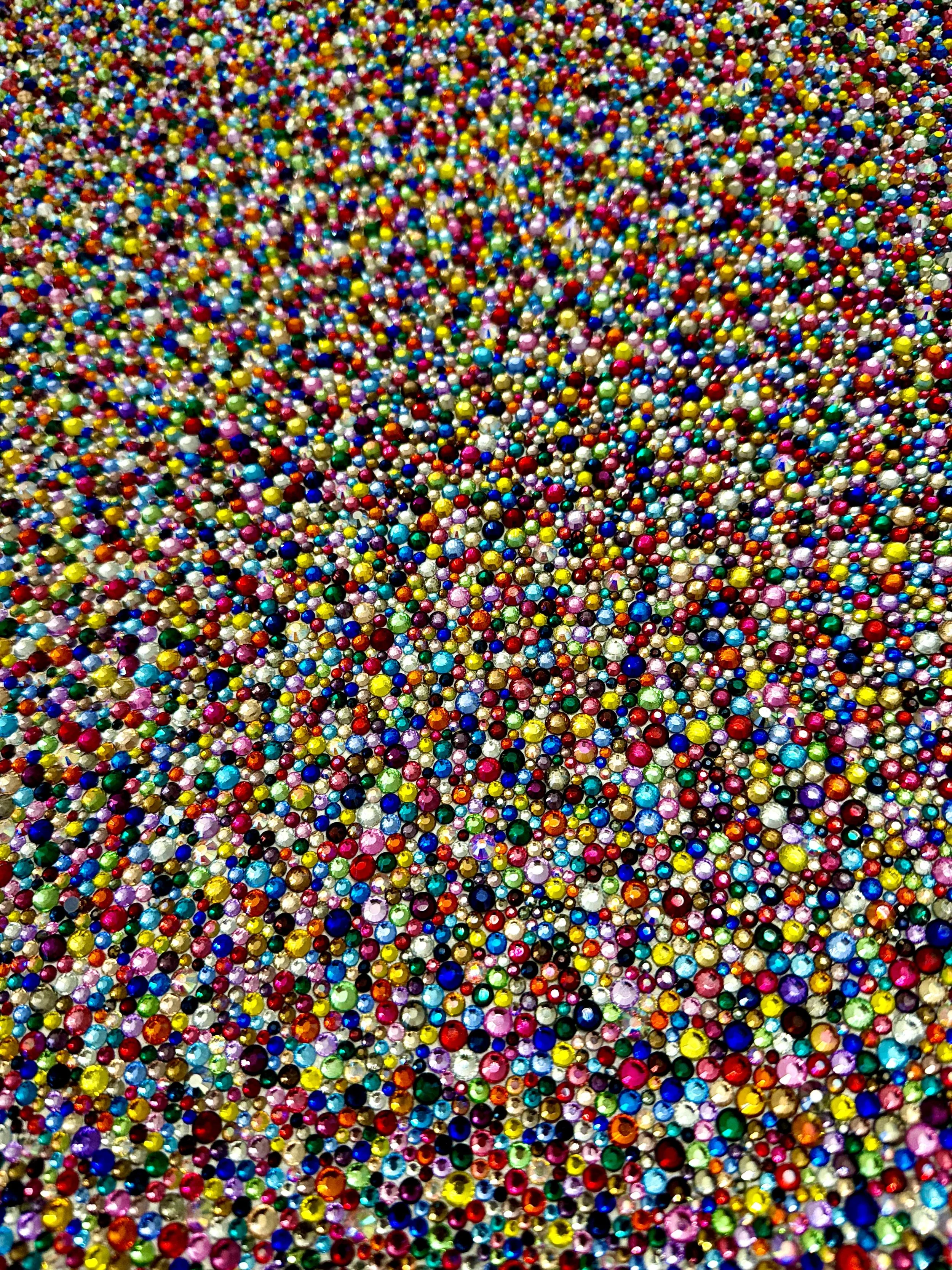 Macro detail of Panic (2026). Close-up of dense, multicolored glass rhinestones showing the shimmering, pointillist texture and faceted light.