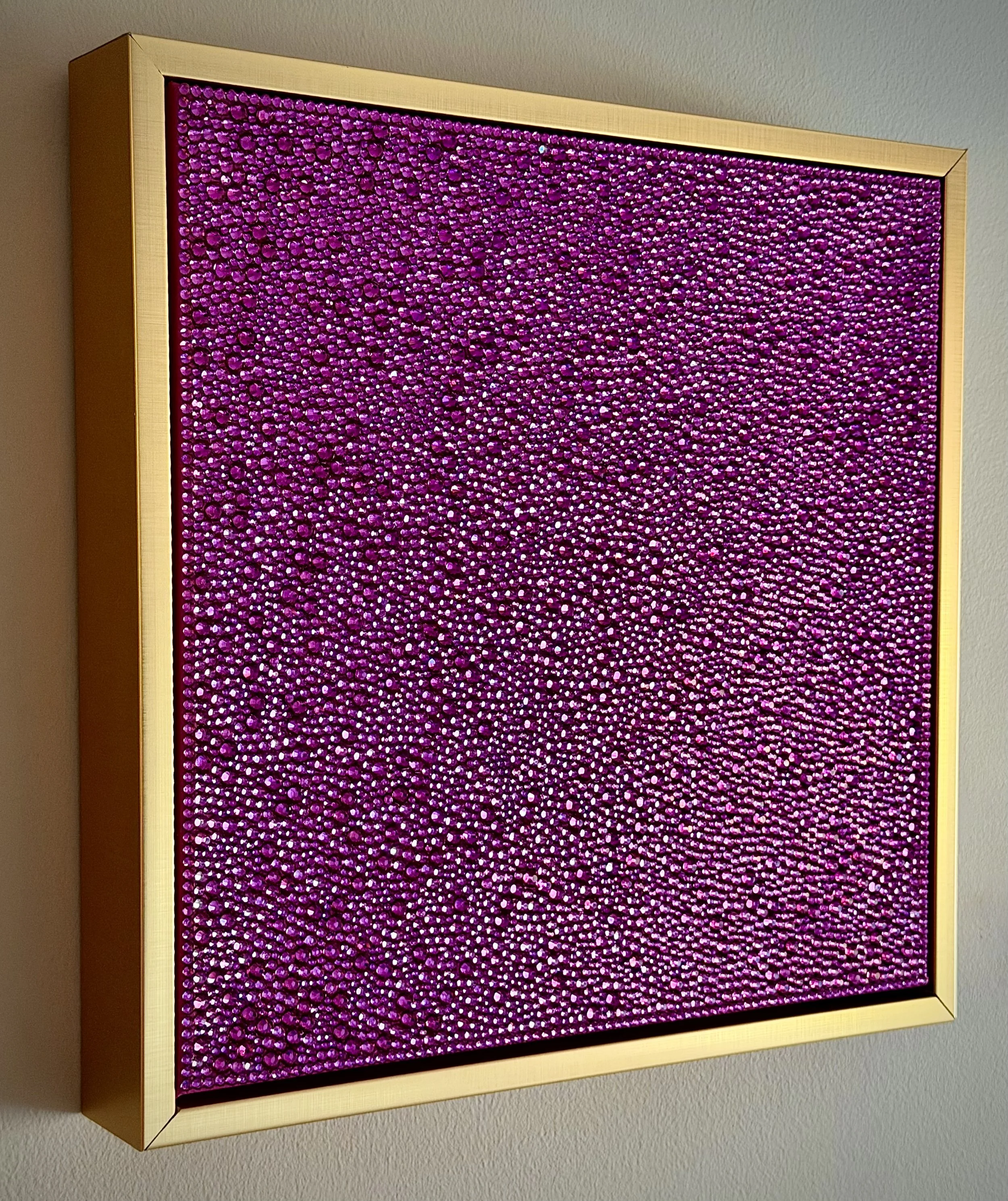 Side view of Lust (2026) showing the 3D texture of fuchsia rhinestones and the gold floating frame. Highlights the depth and sculptural profile.