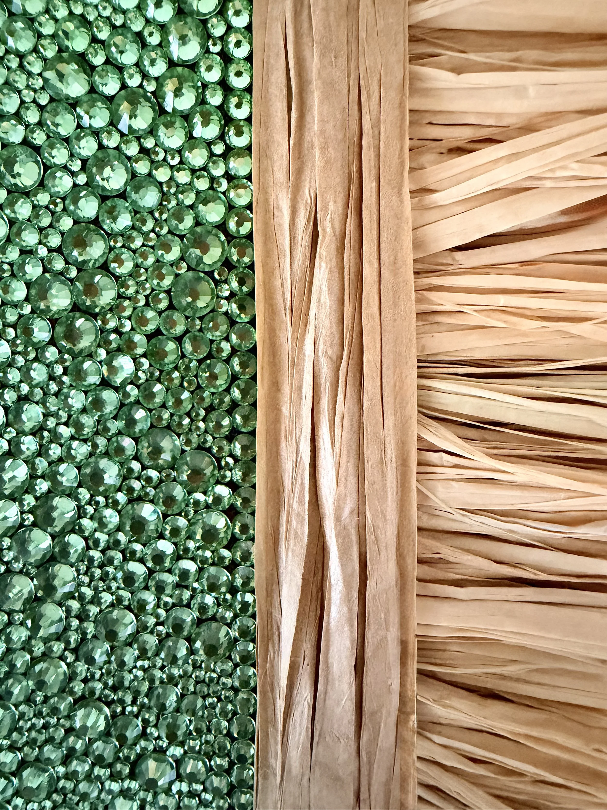 A macro close-up of the "Dissolution" art piece, showcasing multi-sized light green rhinestones and textured natural raffia.