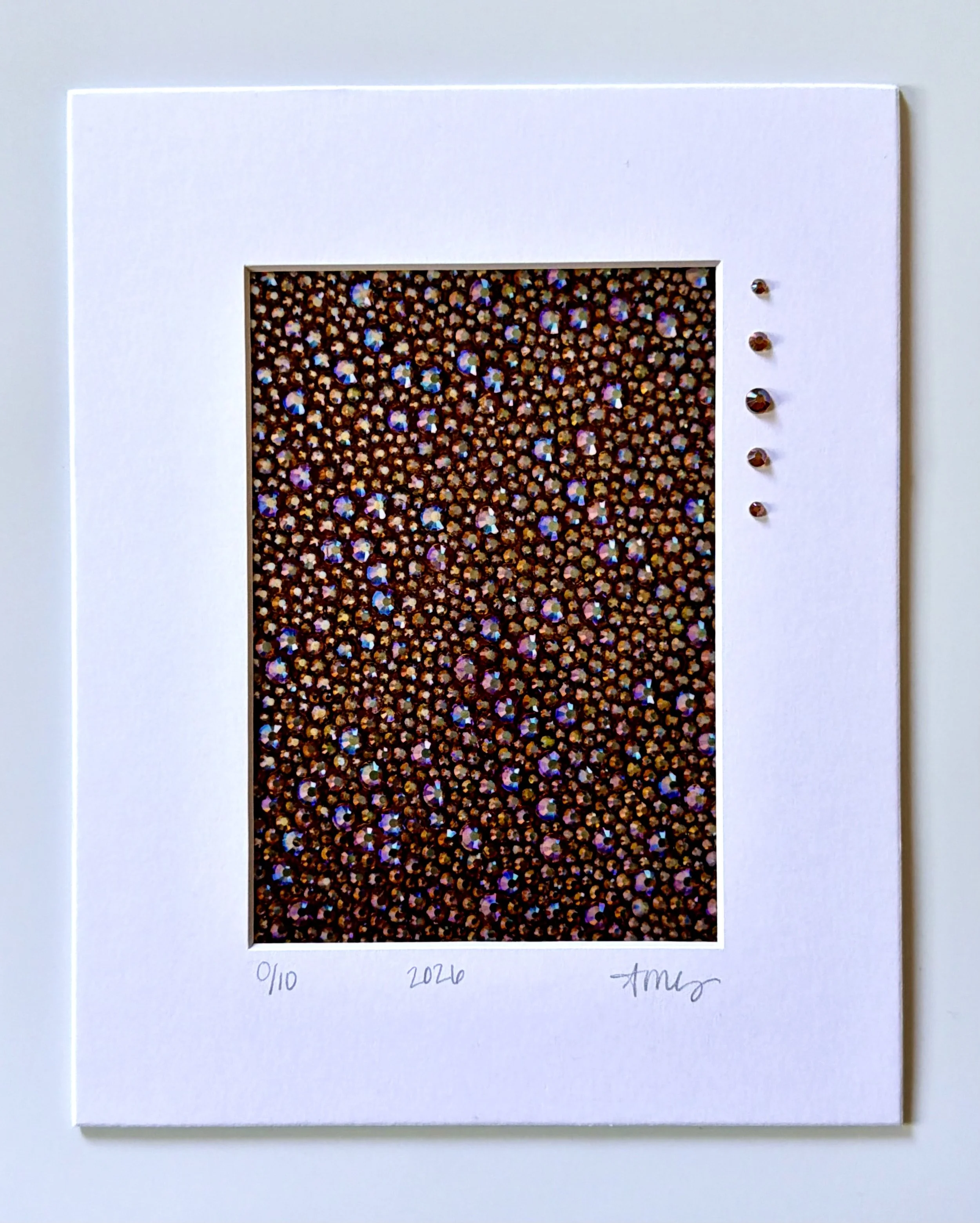 A matted 5x7 macro print of 'Gluttony' featuring hand-placed glass rhinestones and an artist signature on the 8x10 white mat face.