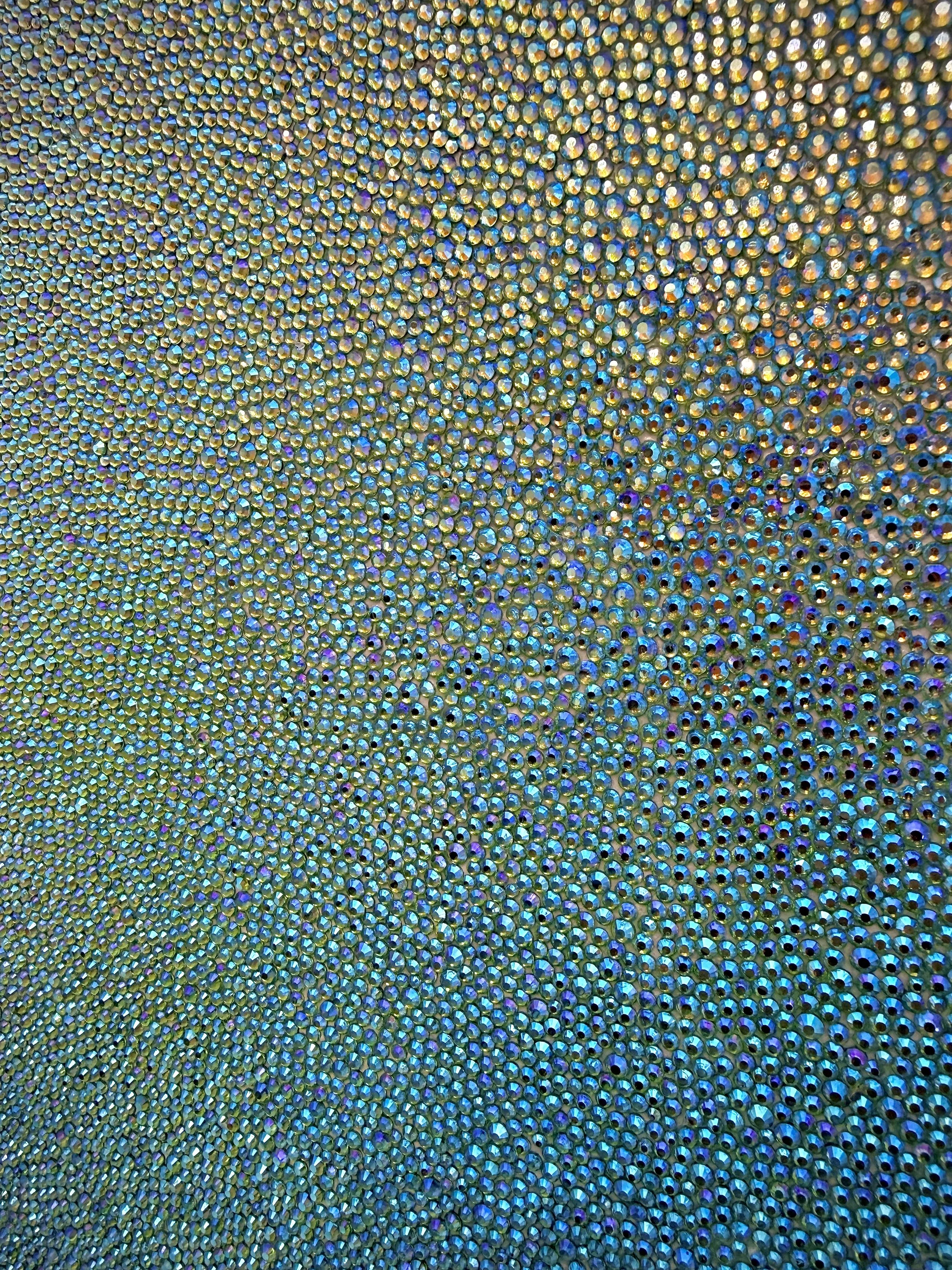 Devoid [Macro], 2025. 12 x 12 in. Close-up of peridot glass rhinestones, emphasizing texture and light over color.