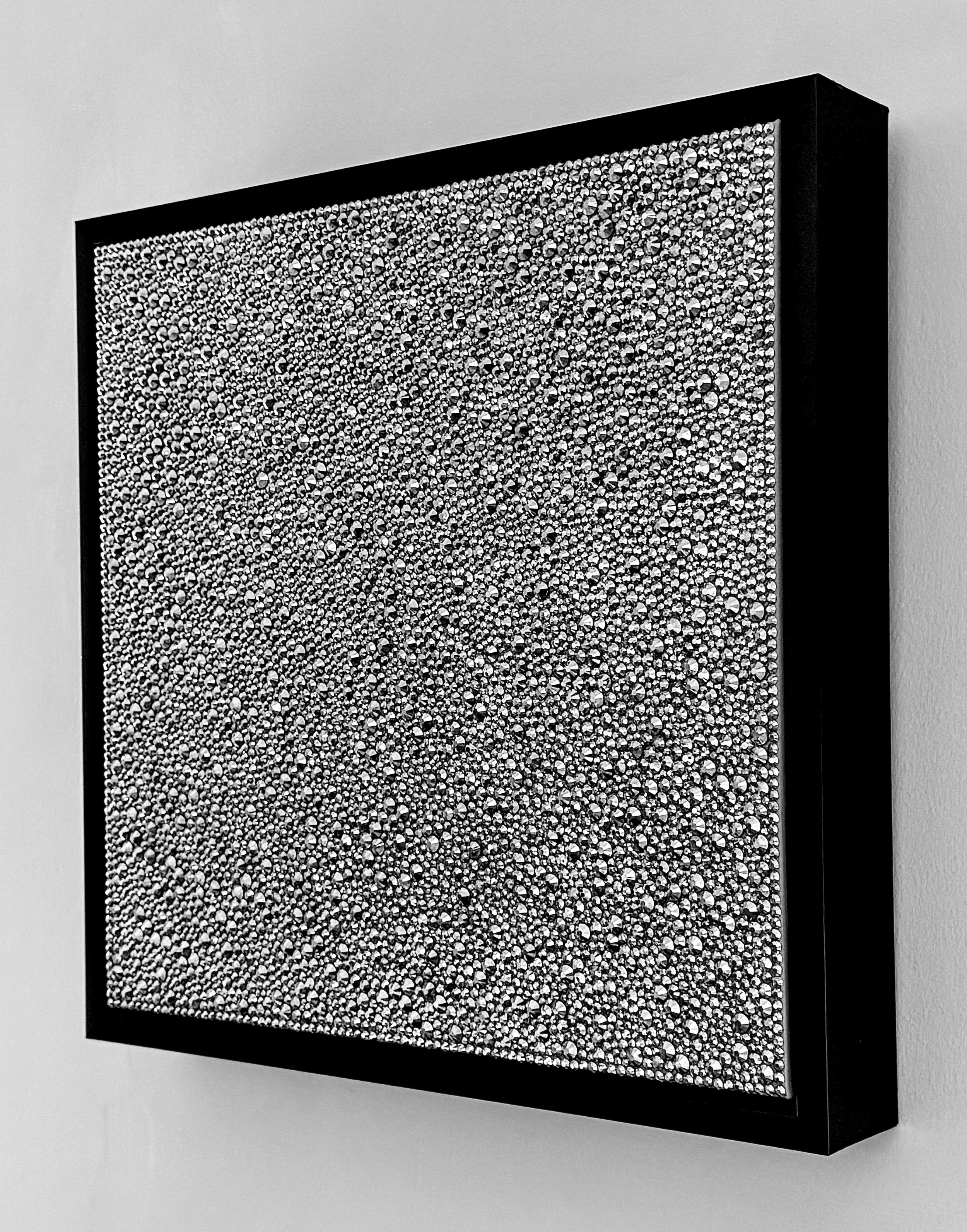 Side view of Sloth (2026) showing the 3D texture of hematite rhinestones and the black floating frame. Highlights the depth and sculptural profile.