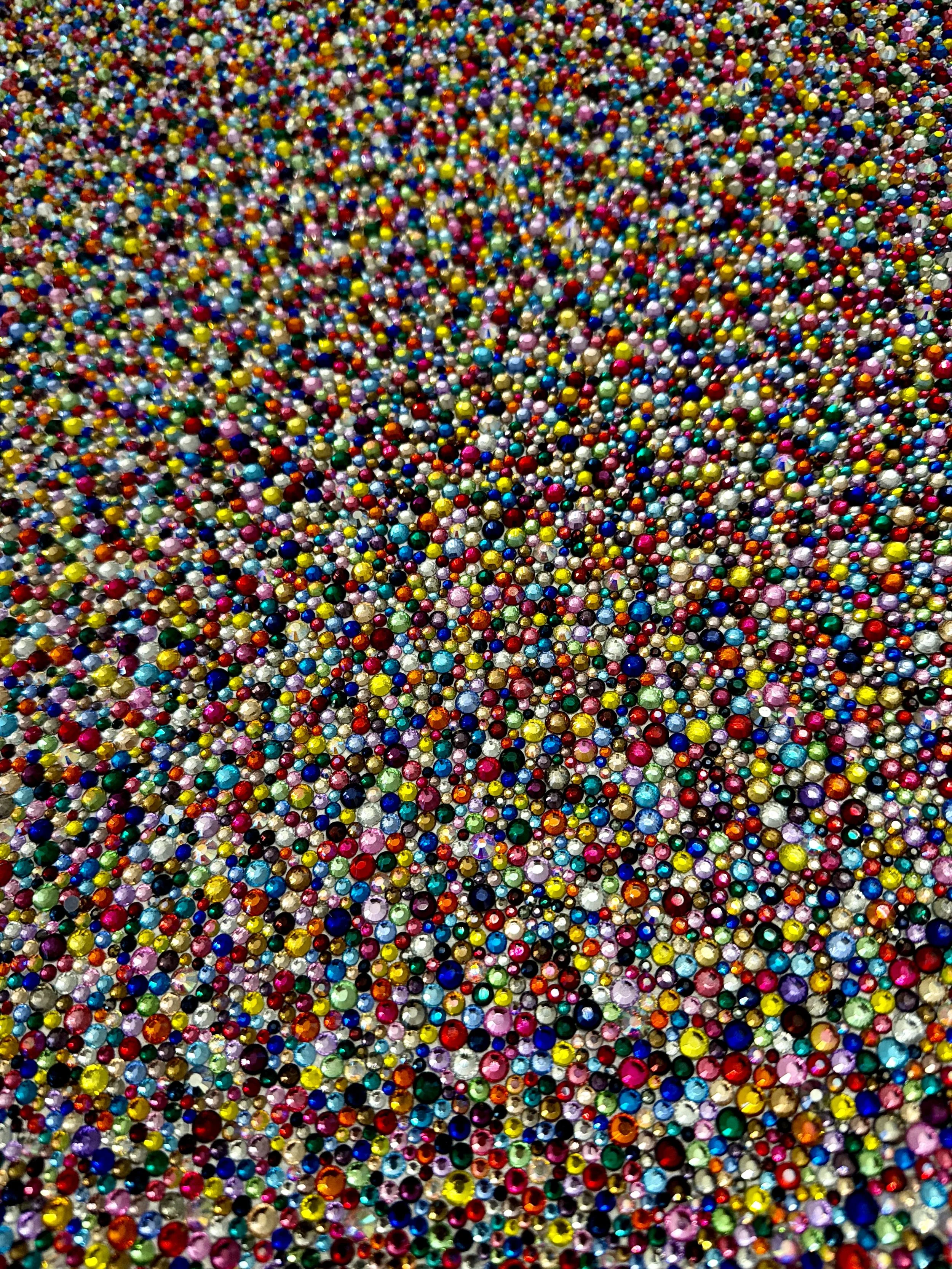 Macro detail of Panic (2026). Close-up of dense, multicolored glass rhinestones showing the shimmering, pointillist texture and faceted light.
