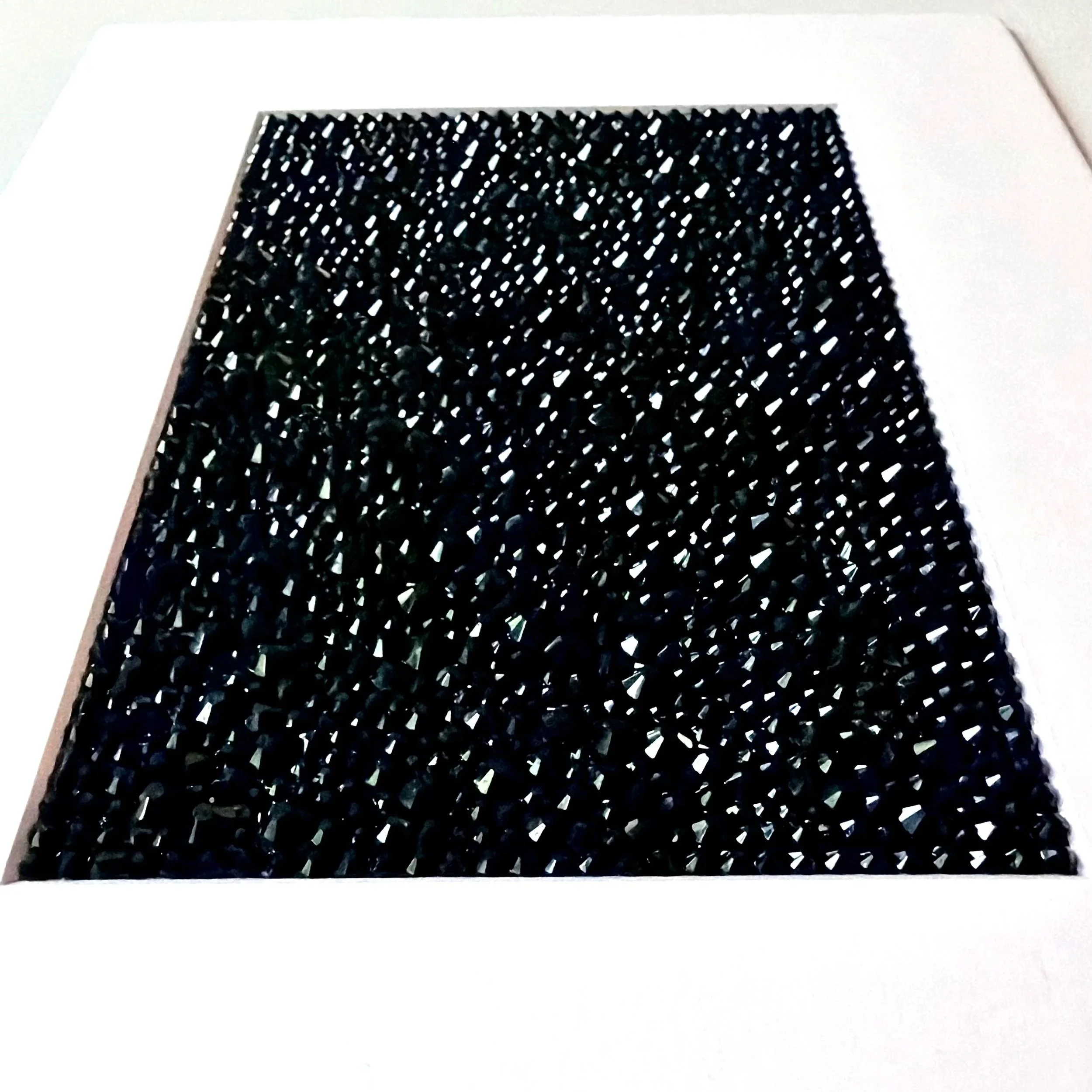 A macro detail shot of shimmering black rhinestones catching the light on the "Tension" original paper study.