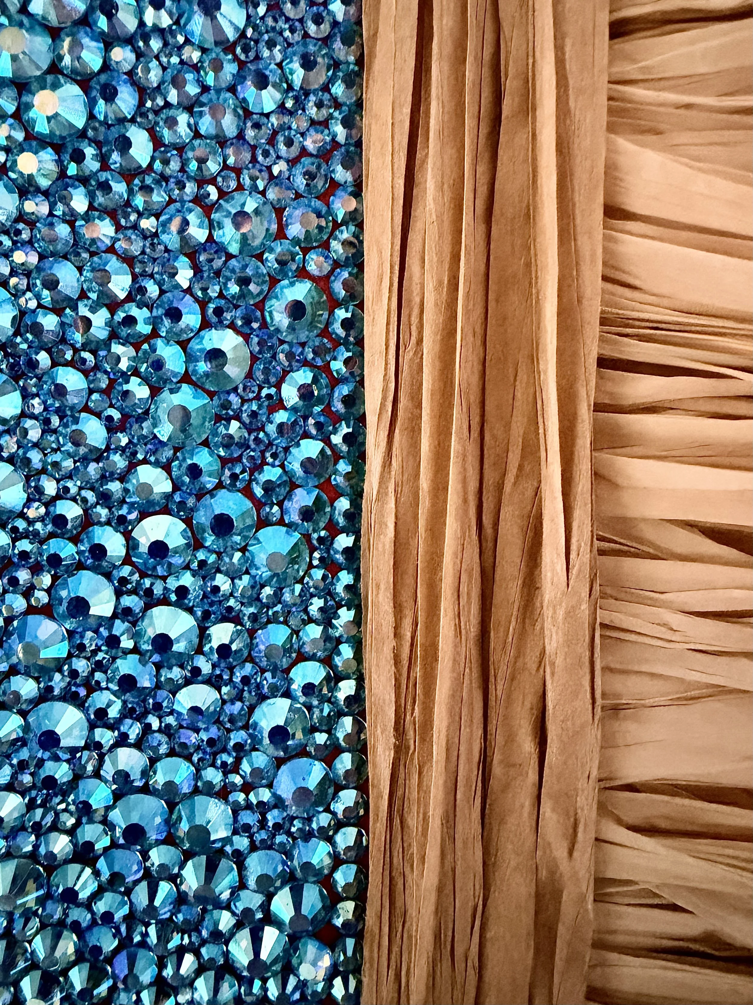 A macro close-up of the "Entropy" art piece, showcasing multi-sized aqua AB rhinestones and textured natural raffia.