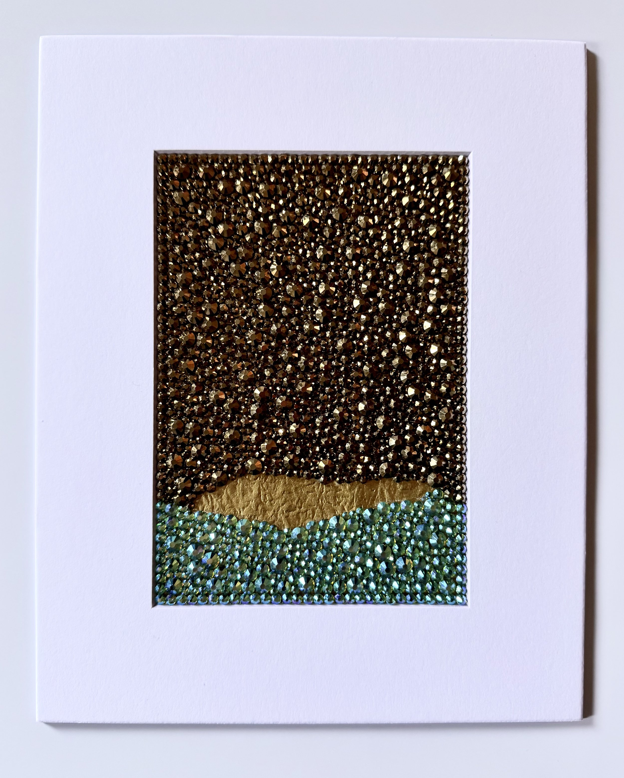 Corrosion, 2026. 5 x 7 in. [matted to 8 x 10 in.] A dense, shimmering field of peridot ab and aurum glass rhinestones on gold origami paper, presented within a clean white mat.