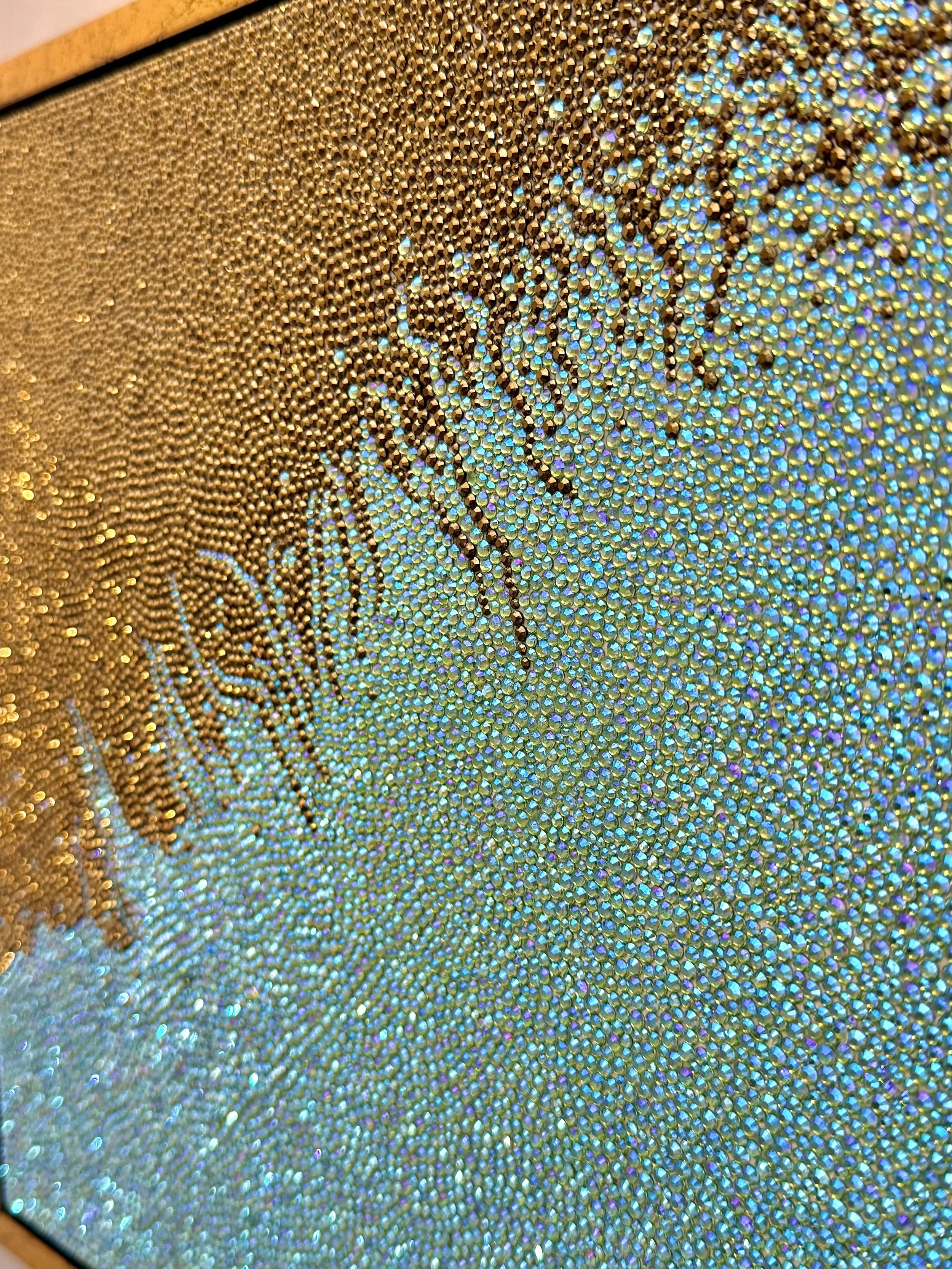 Close-up detail of bronze-gold and peridot glass rhinestones hand-placed in a diagonal bleed. The faceted stones create a rugged, metallic texture that mimics the organic process of chemical erosion.