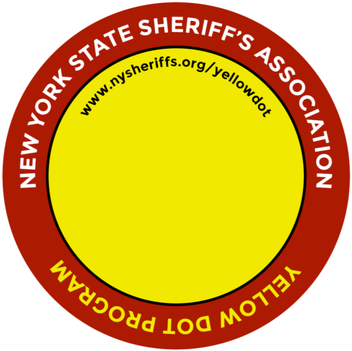 Circular badge with the outer ring in red saying 'New York State Sheriff's Association' and 'Yellow Dot Program.' The inner yellow circle has the website URL 'www.nysheriffs.org/yellowdot'.