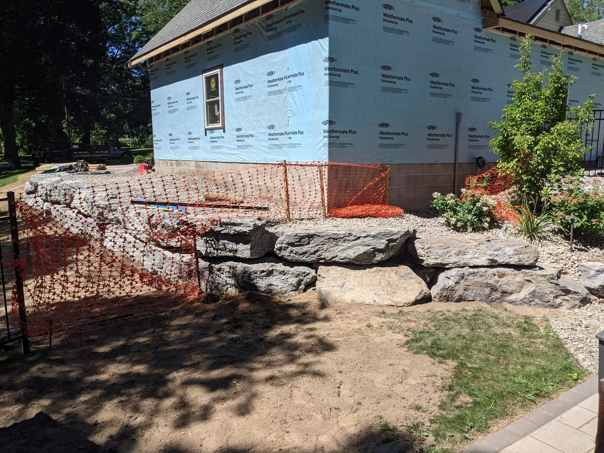 Stonecutter Masonry Boulder Retaining Wall in Buffalo, NY