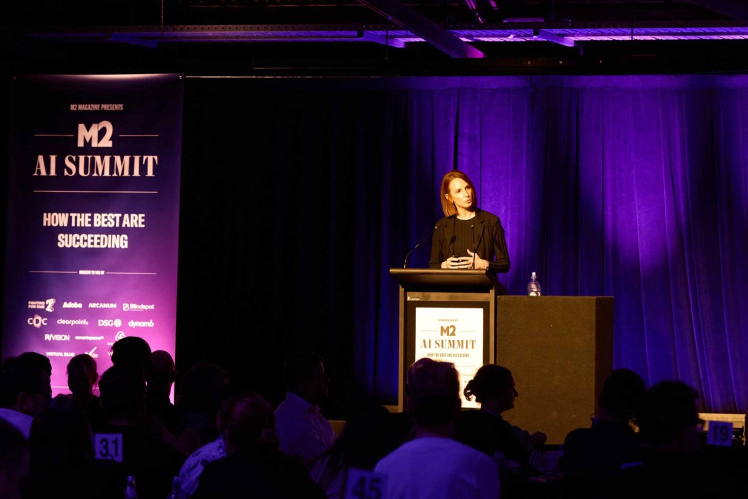 Annie Johnson, popular and influential keynote speaker on AI and the Future of Work giving a speech at the M2 AI Summit. 