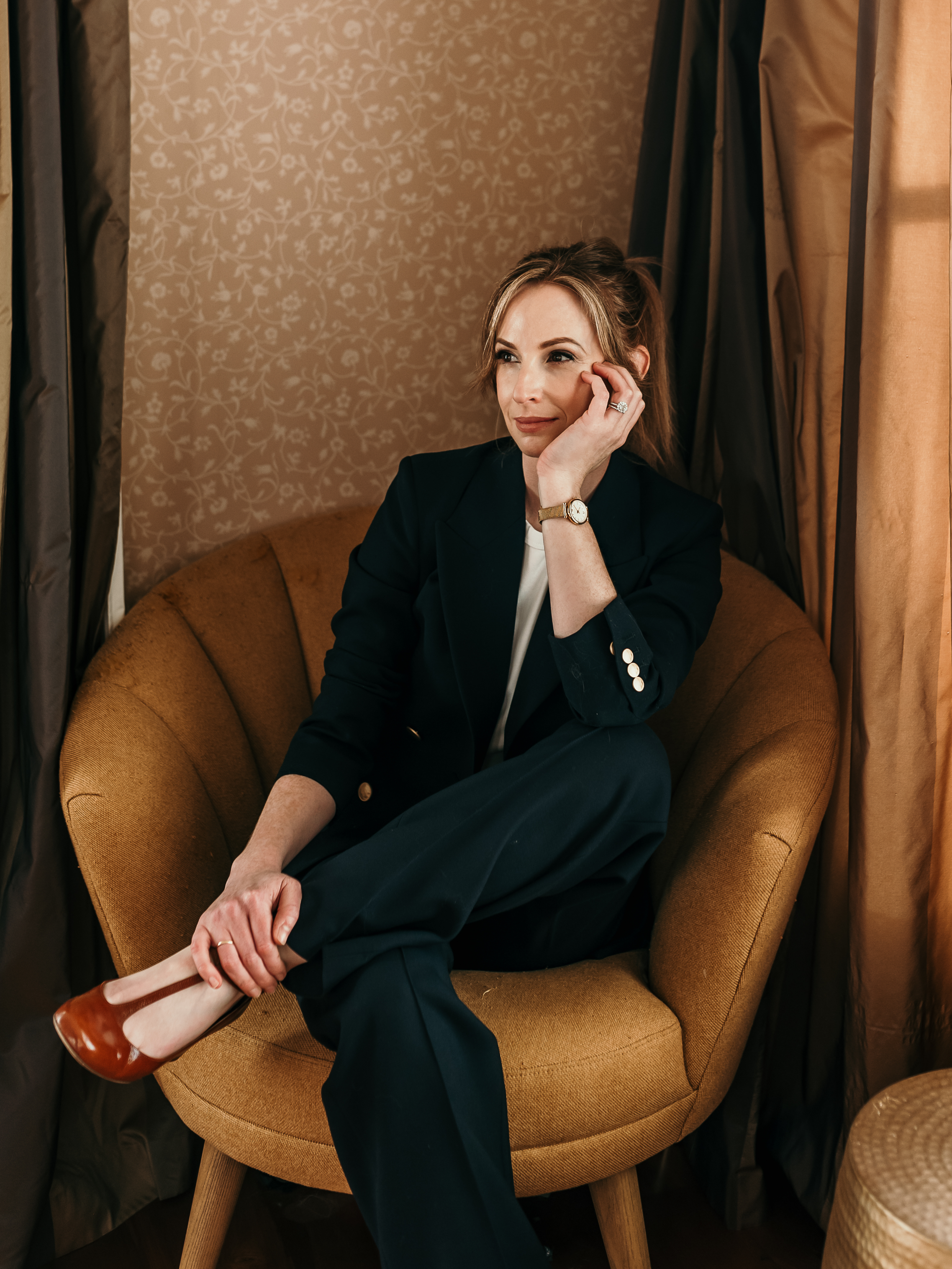 Keynote speaker Annie Johnson, reflecting on AI, leadership, and human-centred work in a styled professional setting.