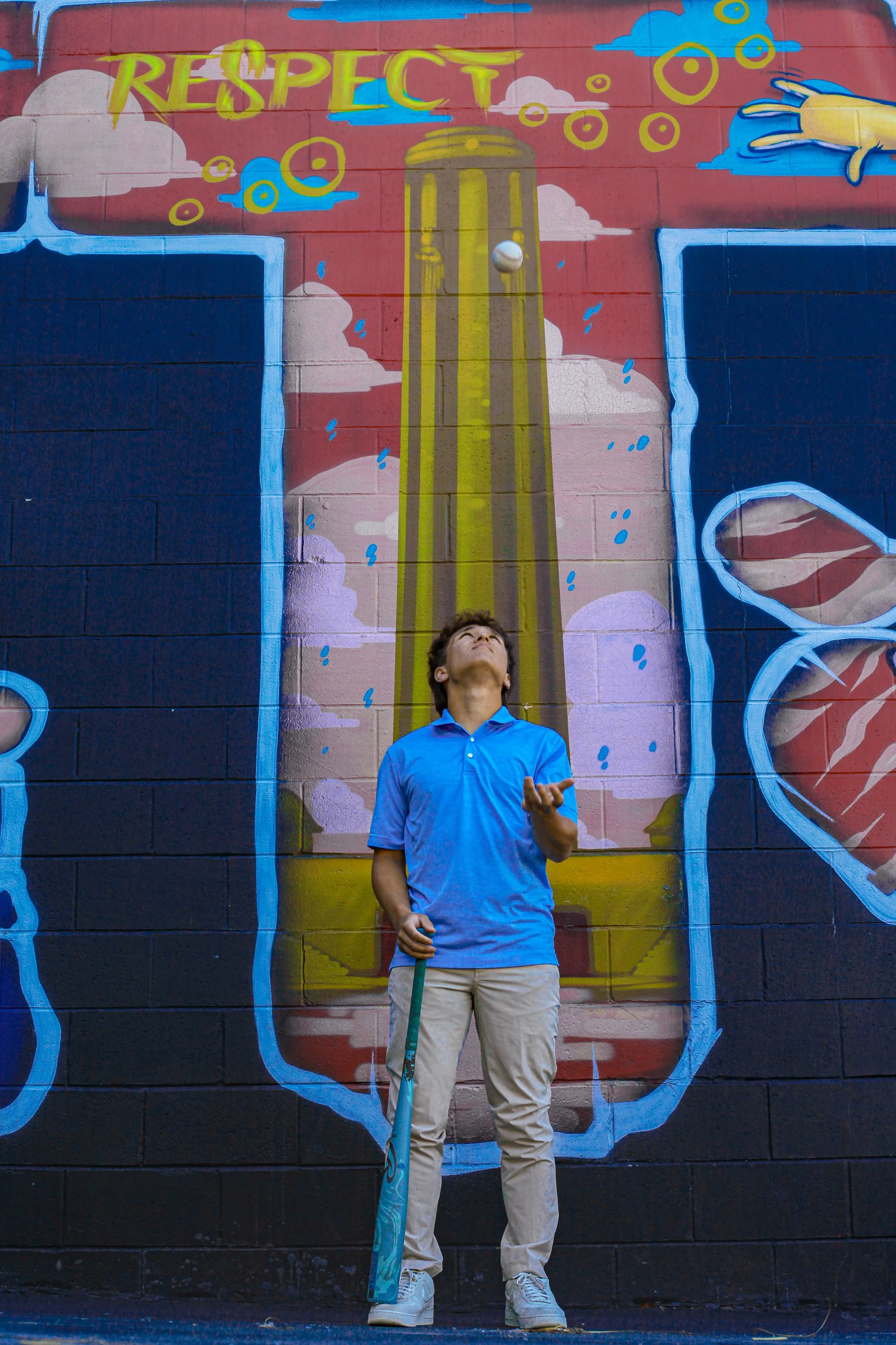 boy-senior-photo-kansas-city-mural-art-blue-baseball-bat