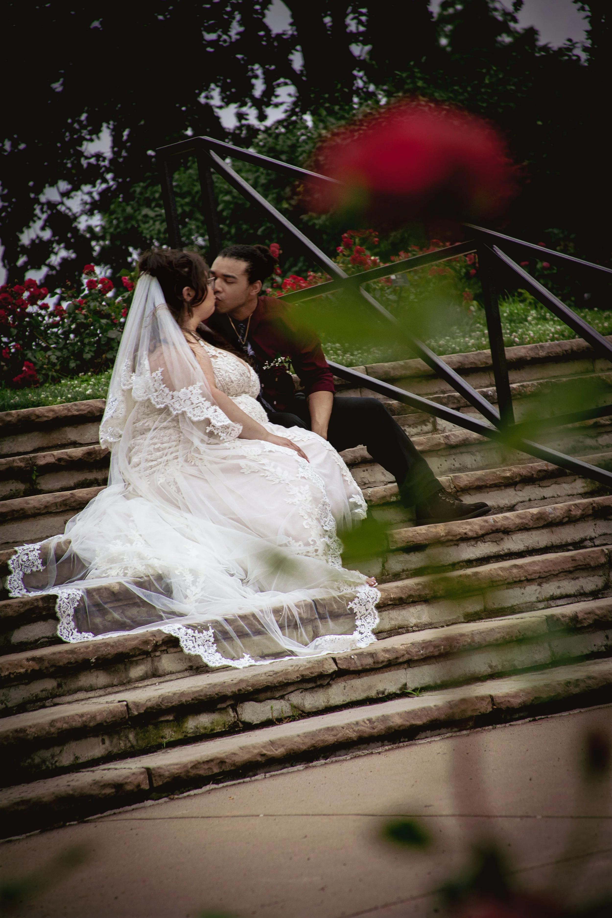 wedding-bride-groom-rose-garden-kansas-city-happy-couple-sweet-wedding-dress-gown-veil-kiss