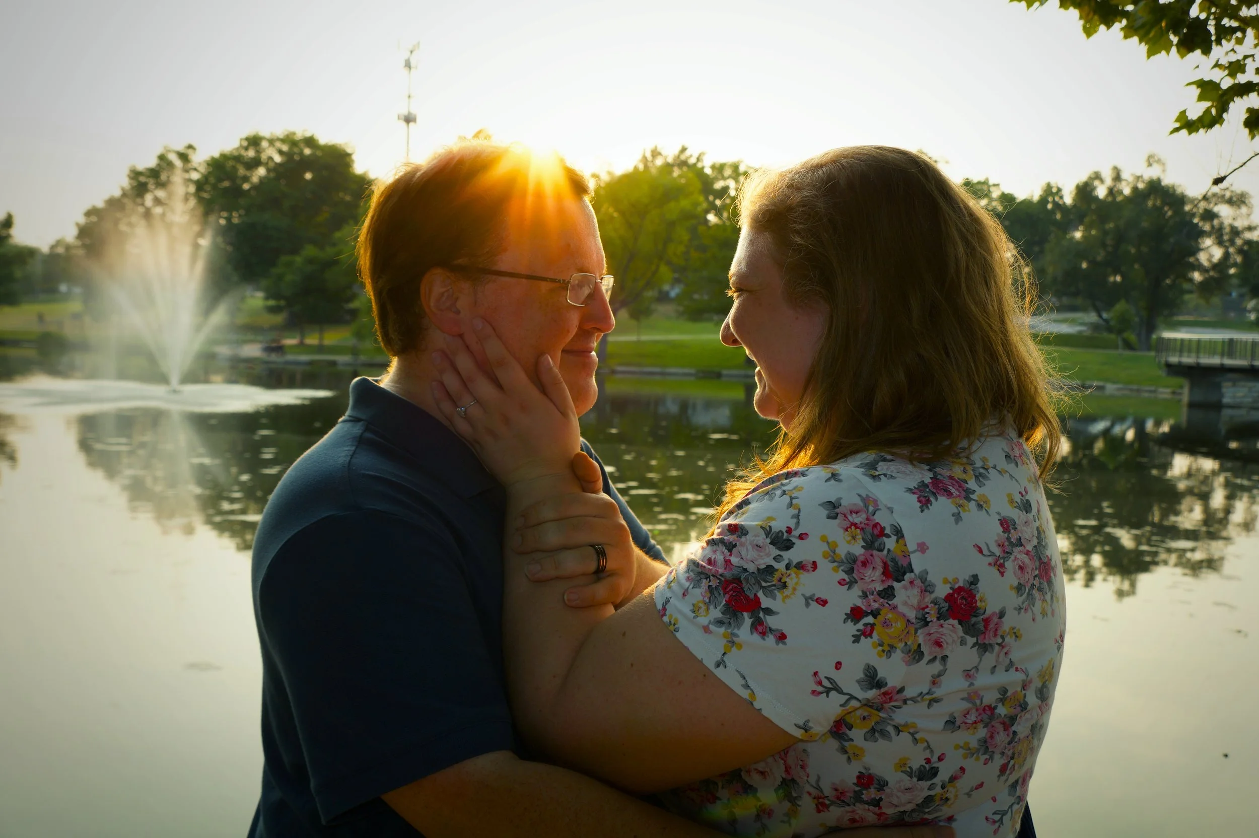 engagement-rings-holding-hands-caress-sunset-lake-happy-couple-nature