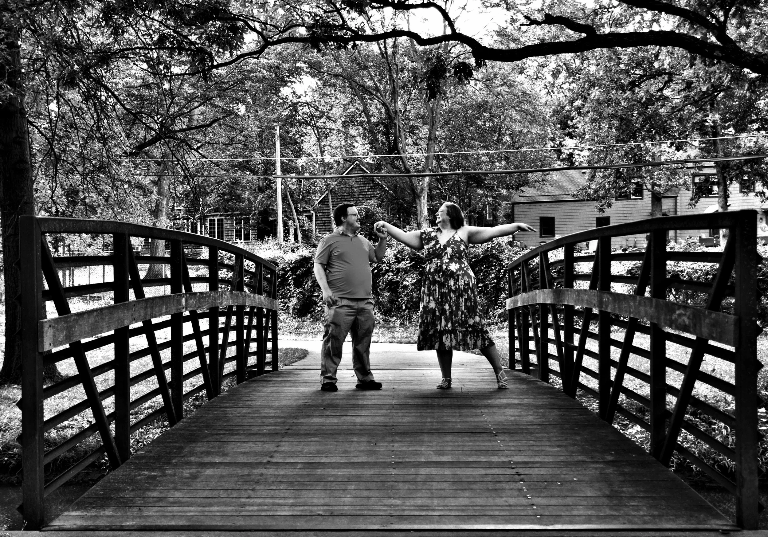 engagement-couple-bridge-black-and-white-dancing