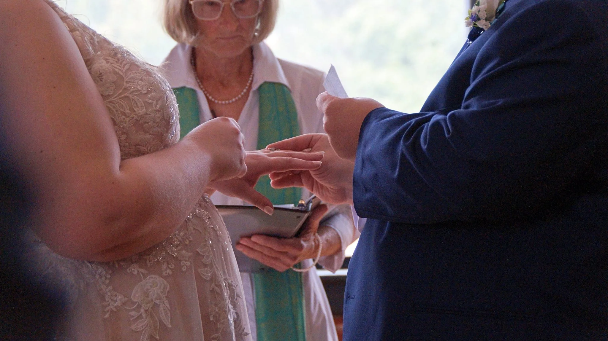 wedding-bride-groom-ring-exchange-officiant