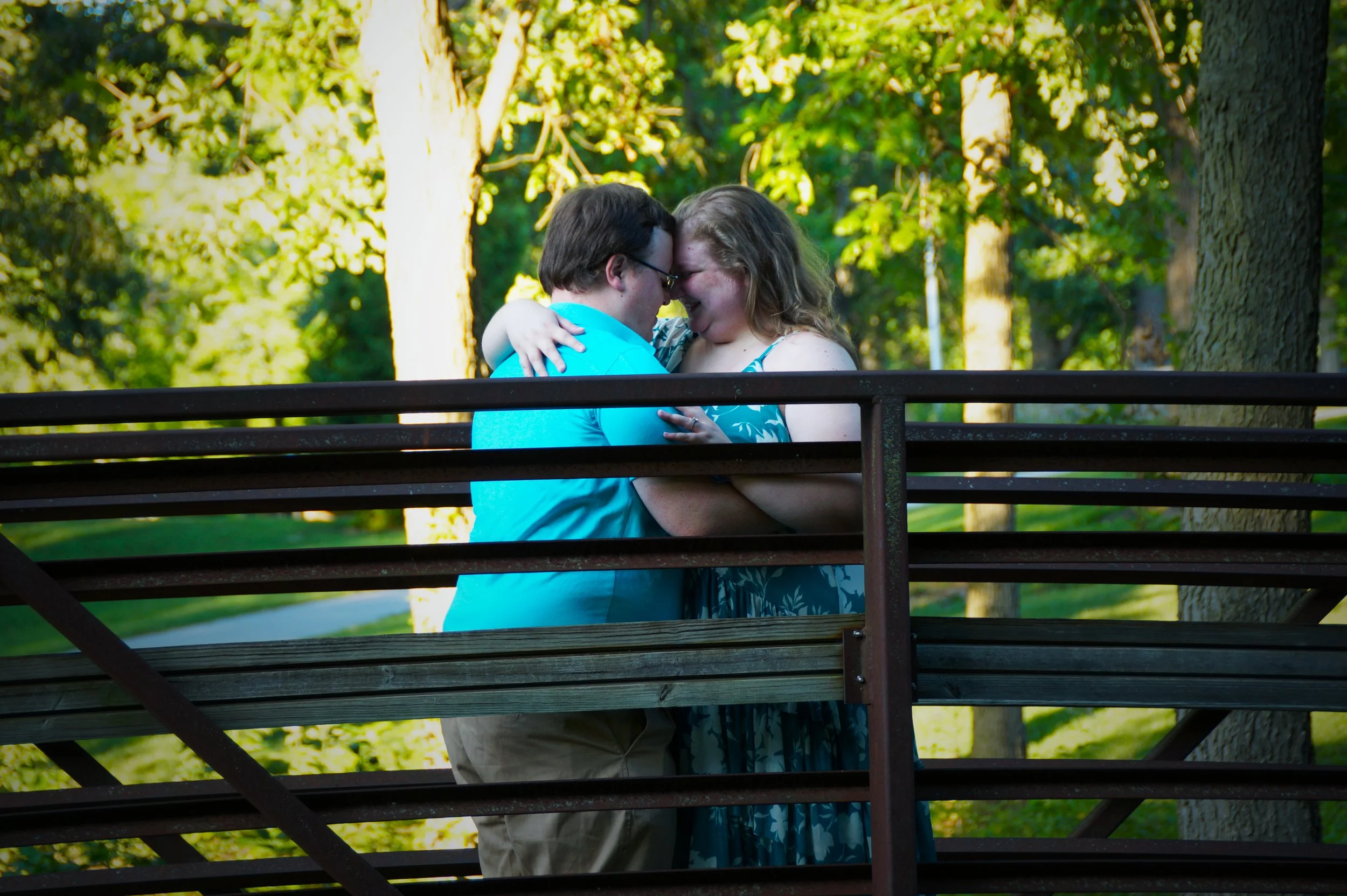 engagement-rings-bridge-happy-couple-nature-trees