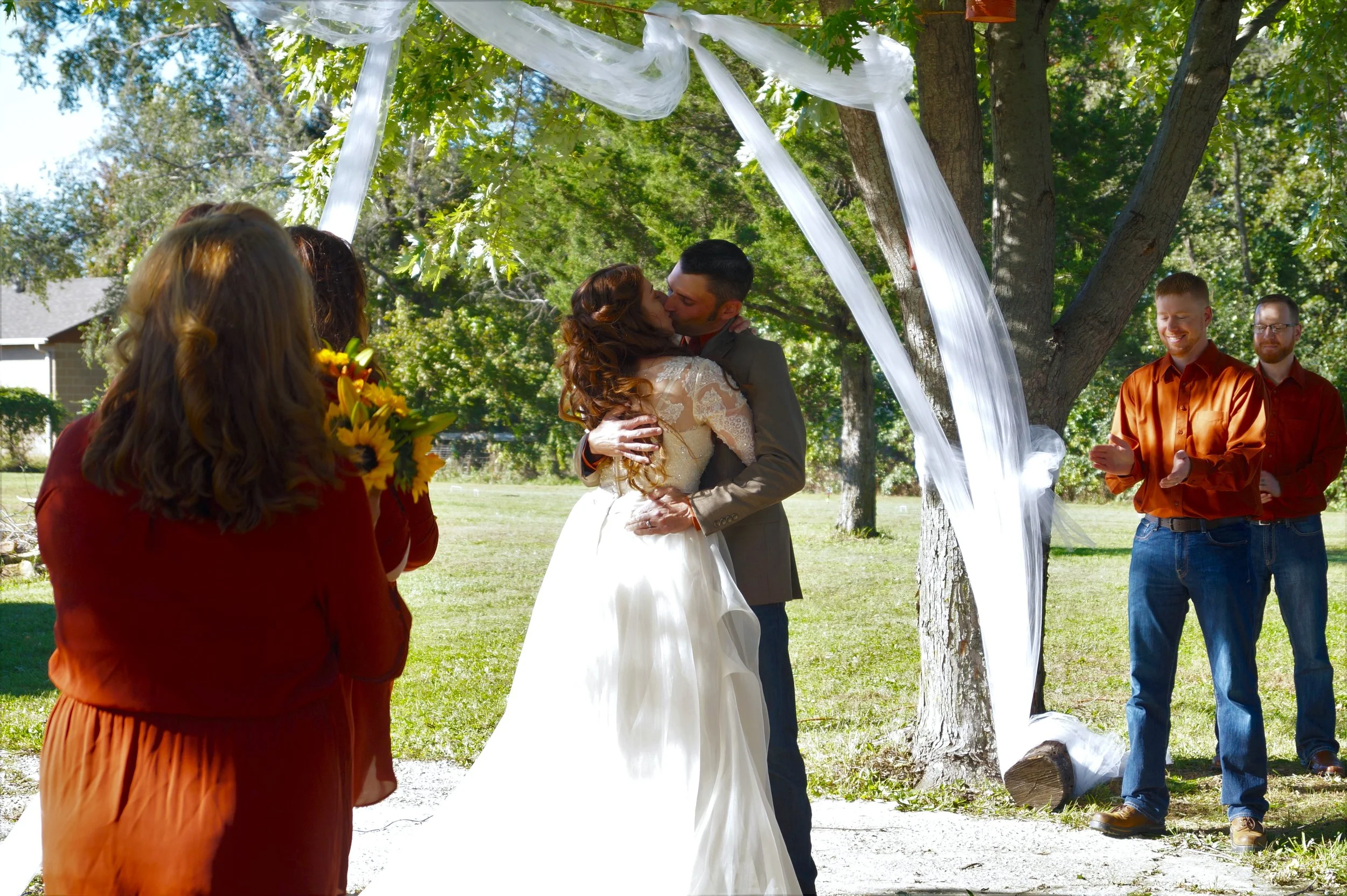wedding-first-kiss-happy-couple-marriage-sunflower-orange-bride-groom