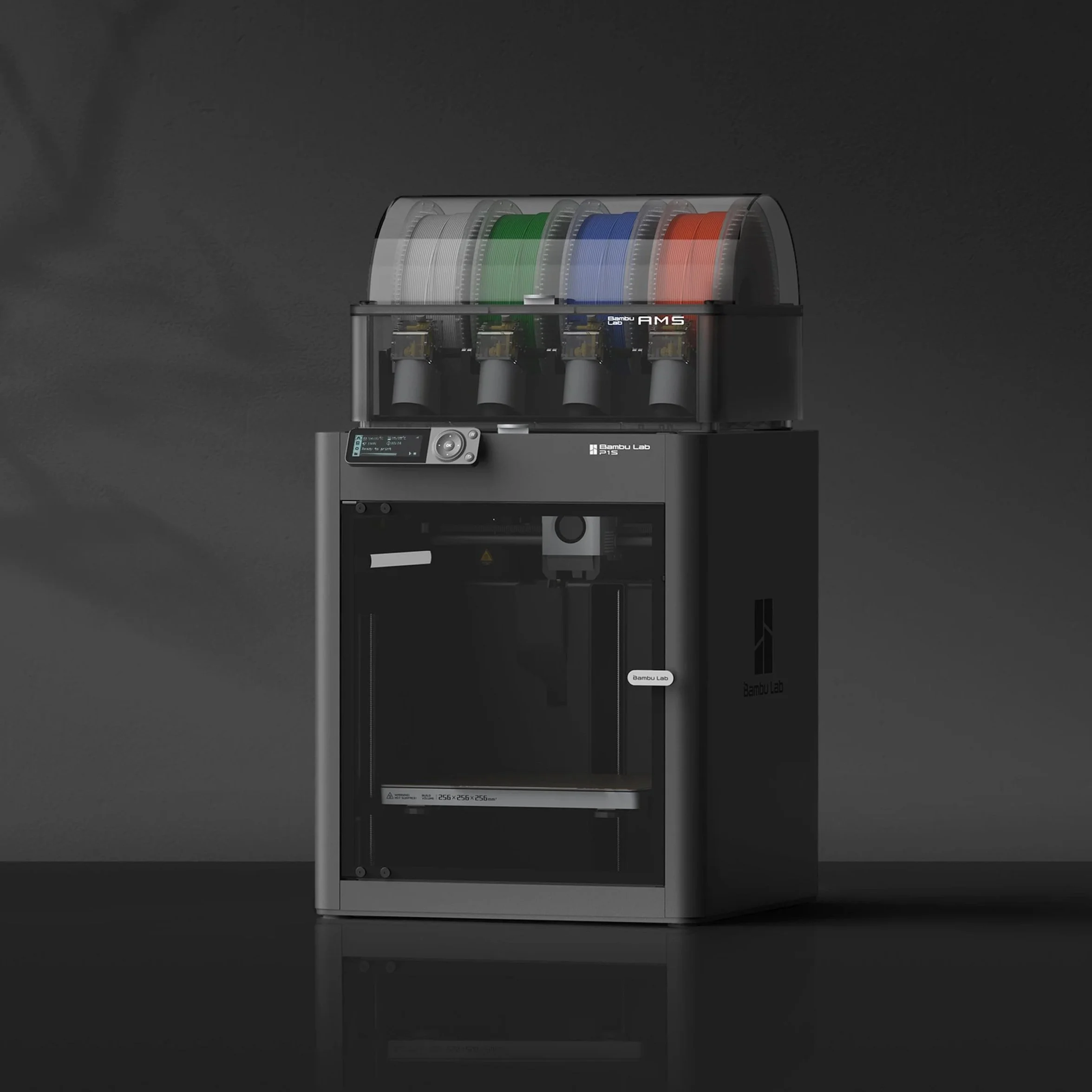 A 3D printer with multiple color filament spools on top and a control panel on the front, set against a dark background.