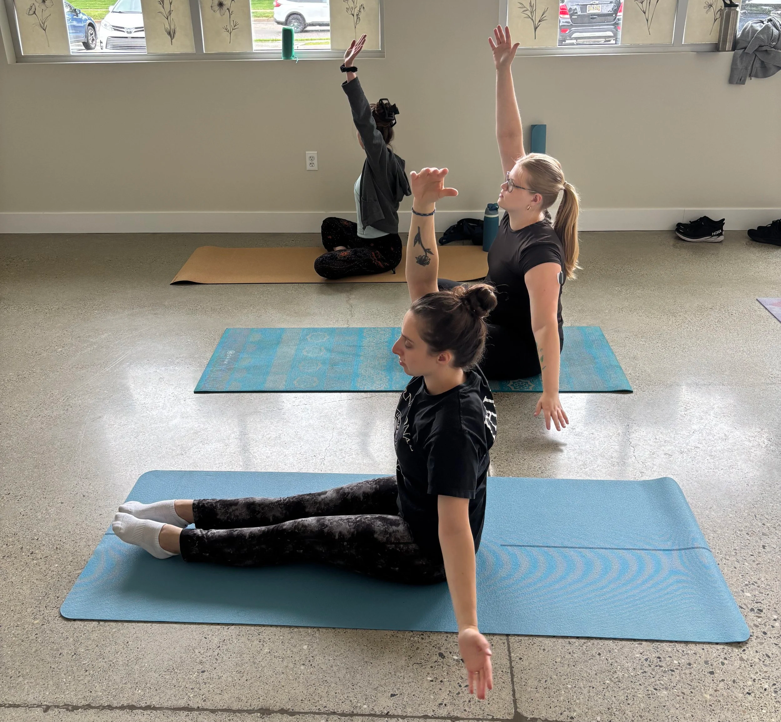 Beginner yoga class practicing poses in Clawson, Michigan