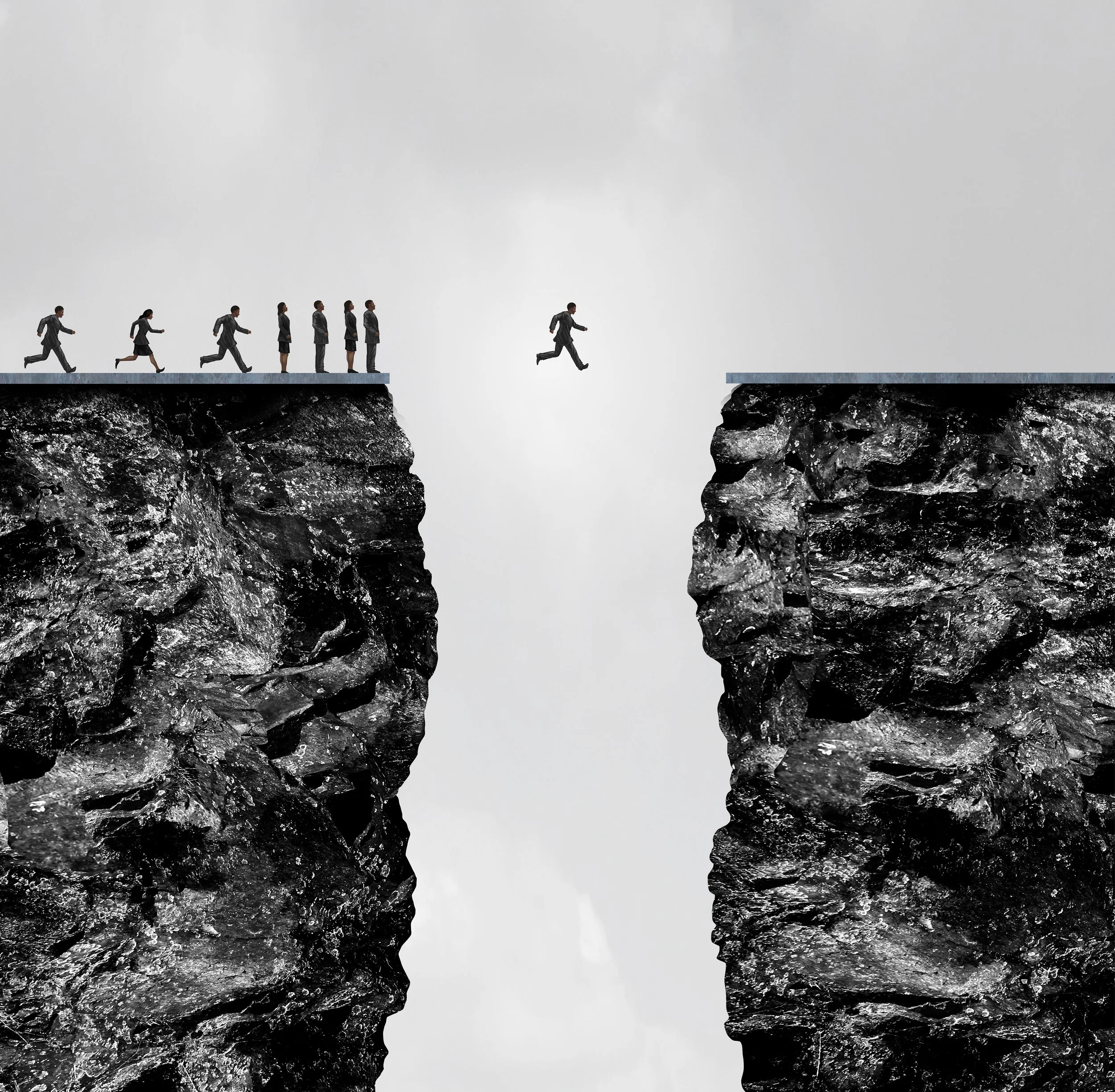 A businesswoman running and jumping from a platform on the left side of a split rocky cliff to the right side over a gap, representing taking risks or overcoming obstacles.