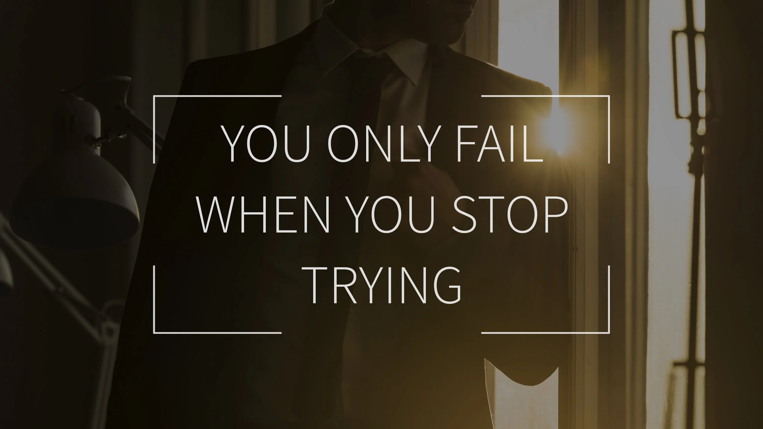 A man in a suit adjusting his collar in front of a window with sunlight coming through. Overlay text reads, 'You only fail when you stop trying.'