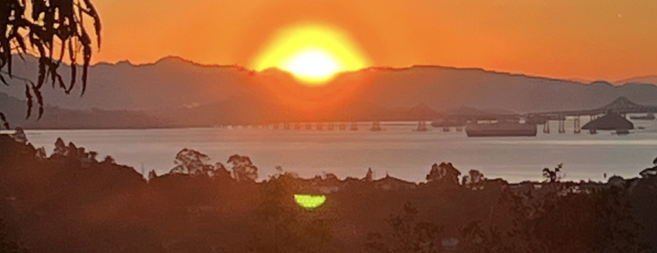 Sun rising over the San Francisco Bay and shining on San Rafael, California