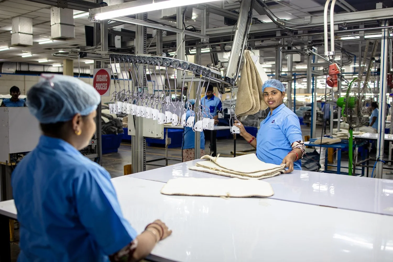 Workers operating a production line inside a factory