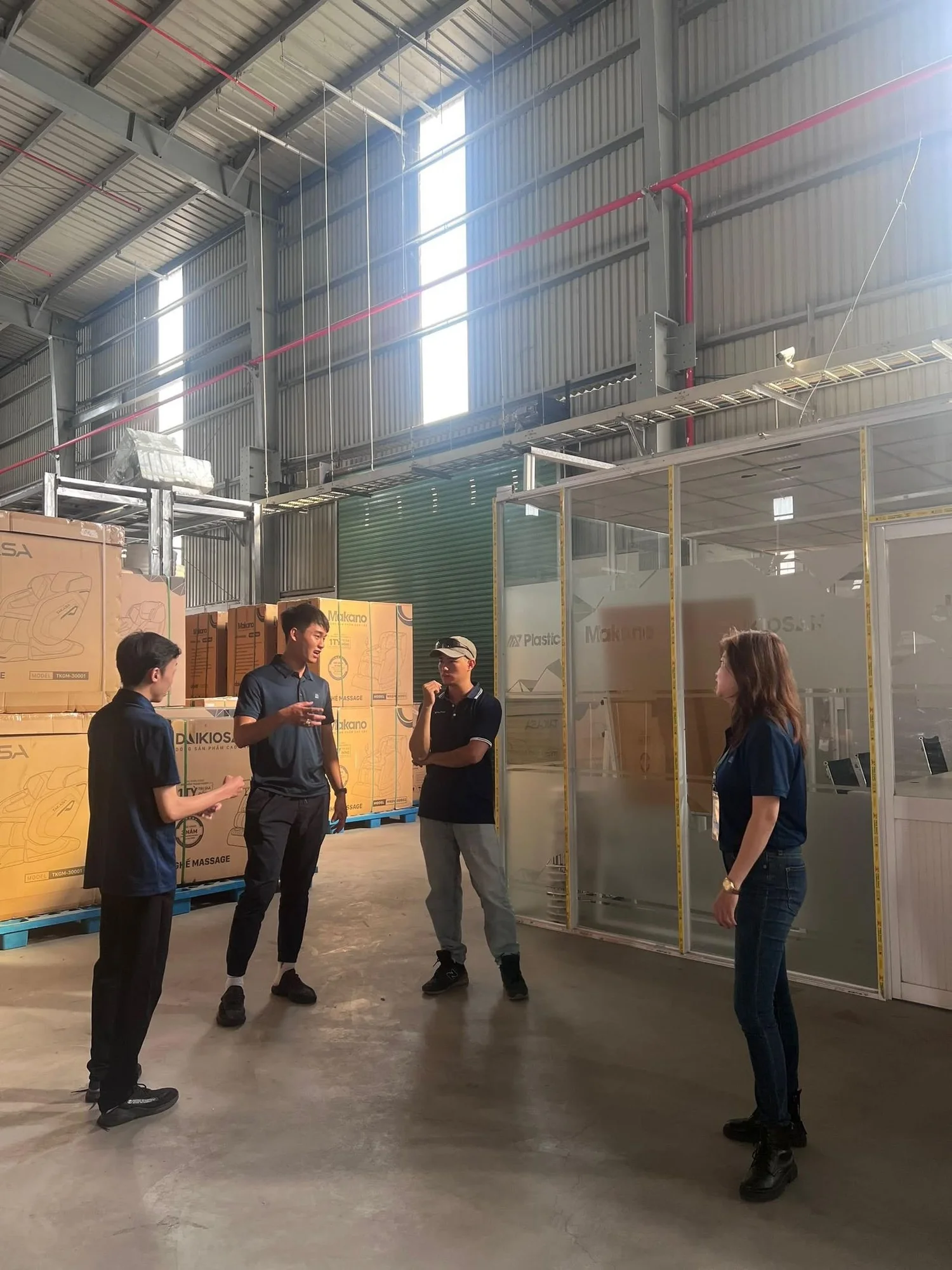 Business team meeting inside an industrial warehouse
