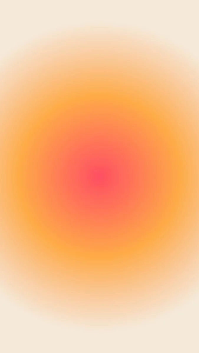Blurred gradient pattern with shades of pink, orange, and yellow.