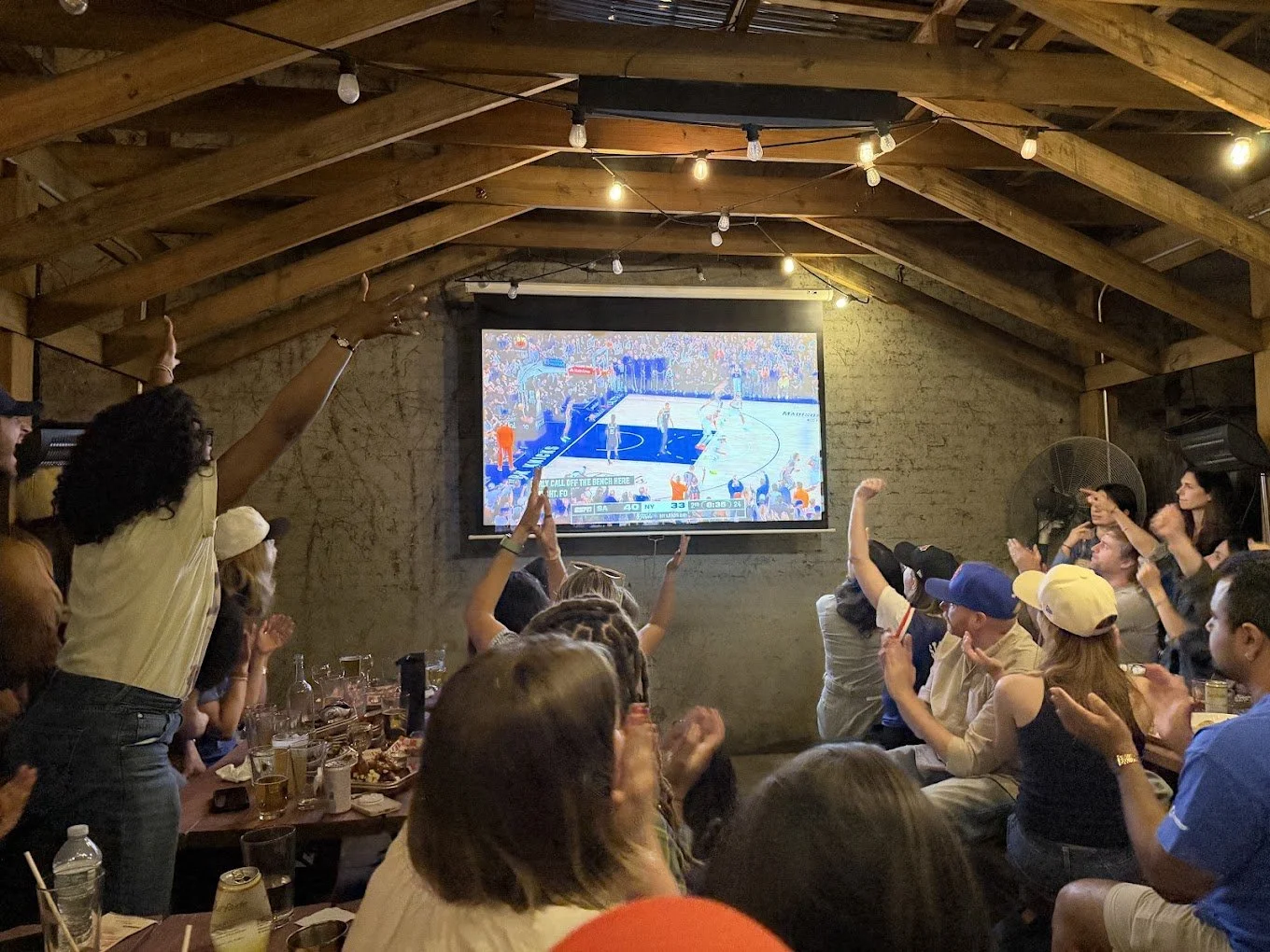 Basketball on the big screen in the back yard