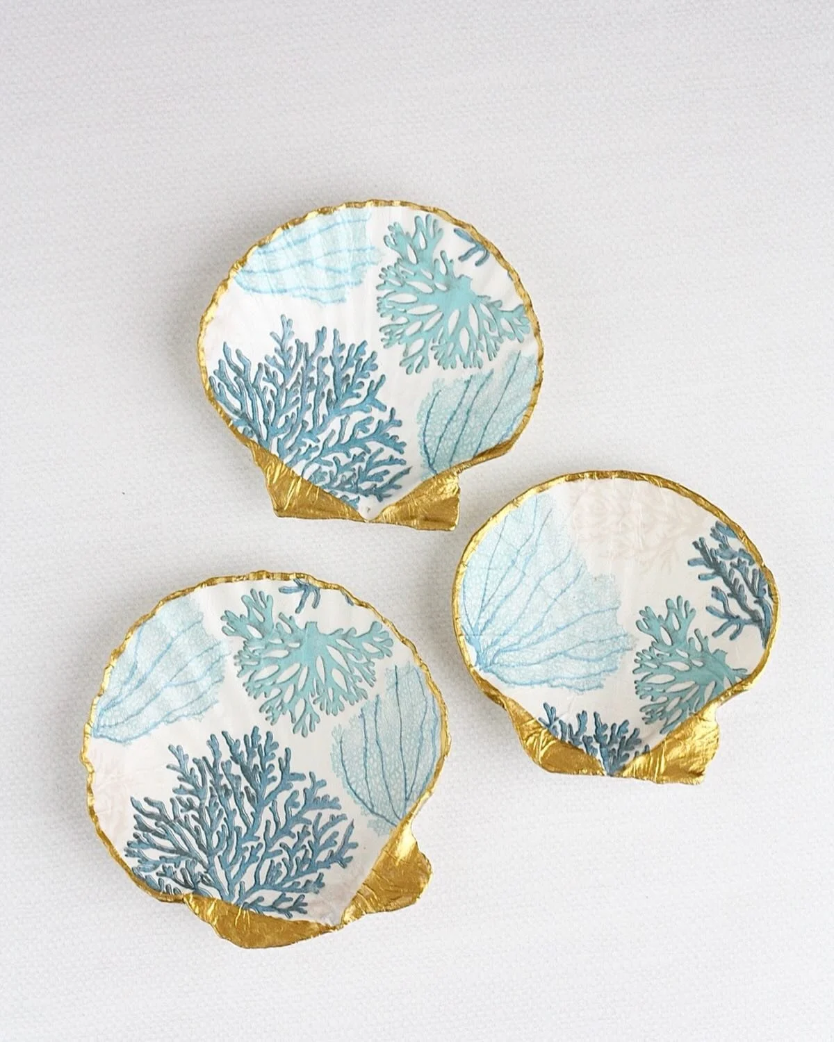 Coastal blues and golden details. 🩵✨ Handcrafted scallop shell ring dishes, each one uniquely made. Available for purchase on Etsy and our website. Links in bio.

#coastaldecor #ringdish #handmadehome