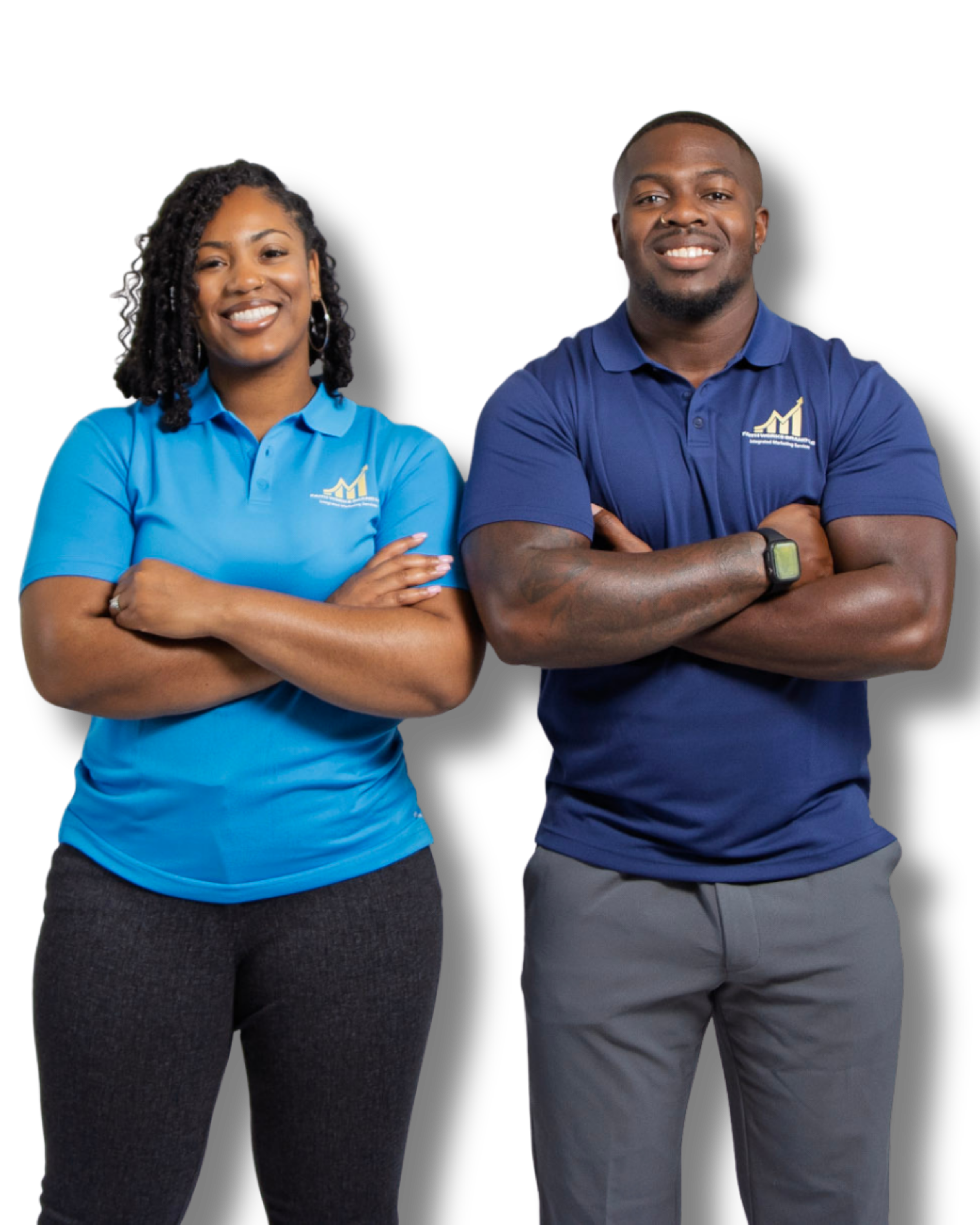 Two individuals wearing matching blue shirts with a logo, standing side by side with arms crossed, smiling against a black background.