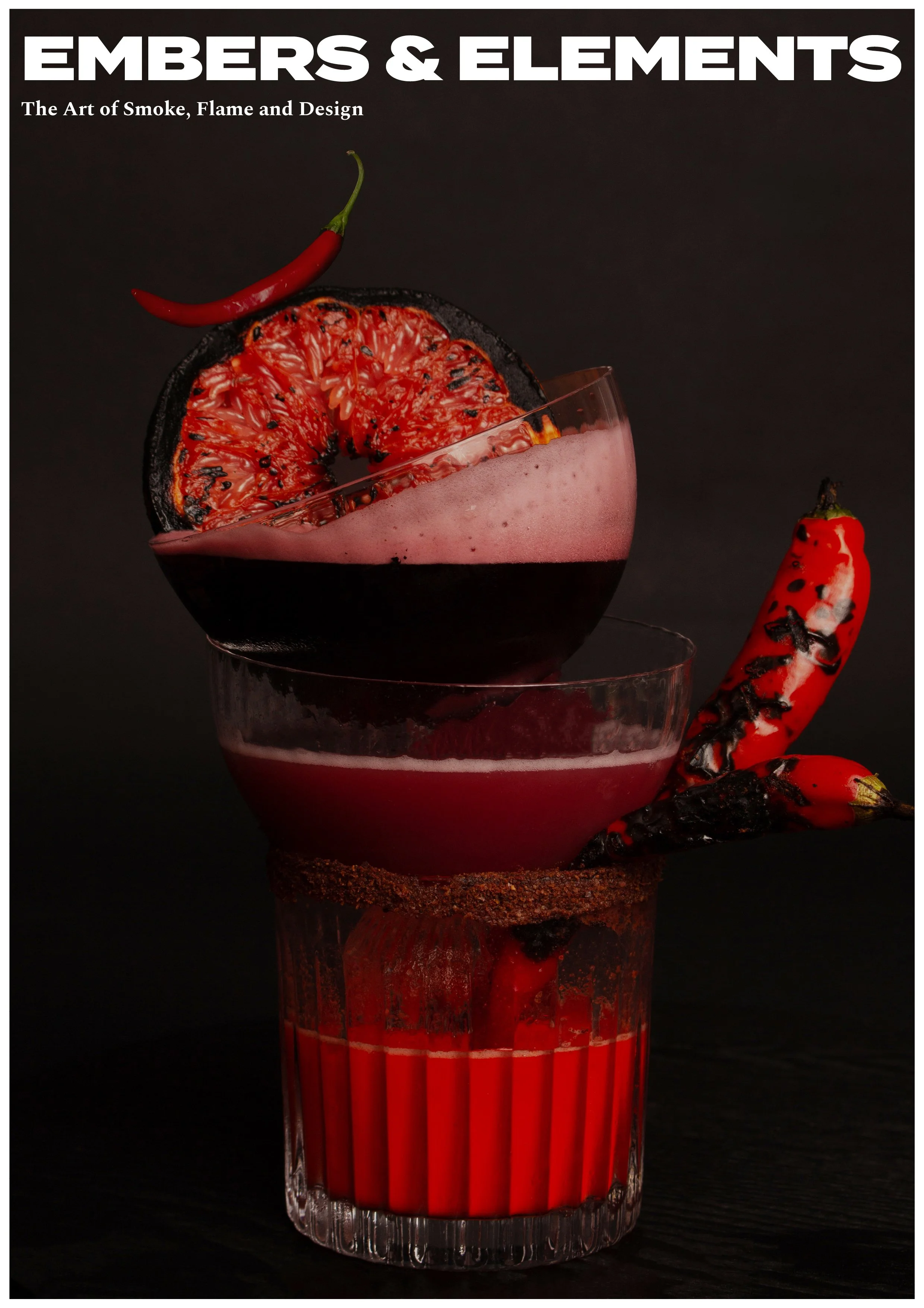 Cover of a book titled 'Embers & Elements: The Art of Smoke, Flame and Design' featuring a layered red drink in a glass, garnished with charred chili peppers and a grilled grapefruit slice against a dark background.