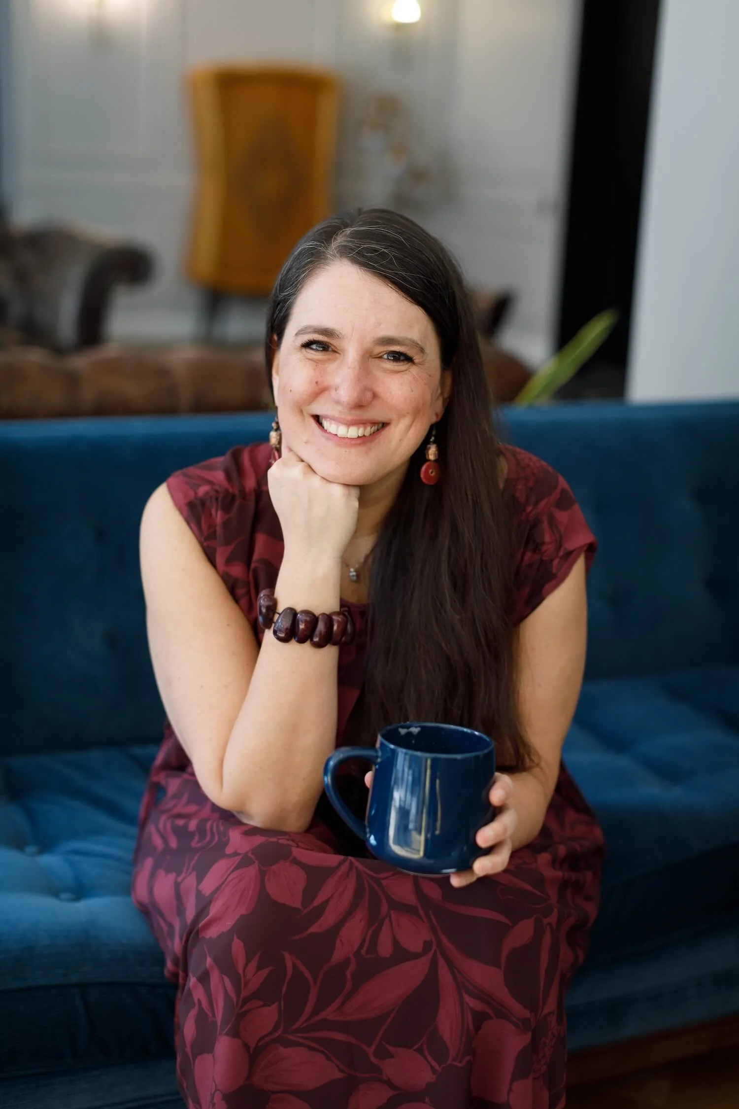 Clara Moisello, PhD, NVC trainer and neuroscientist, smiling thoughtfully